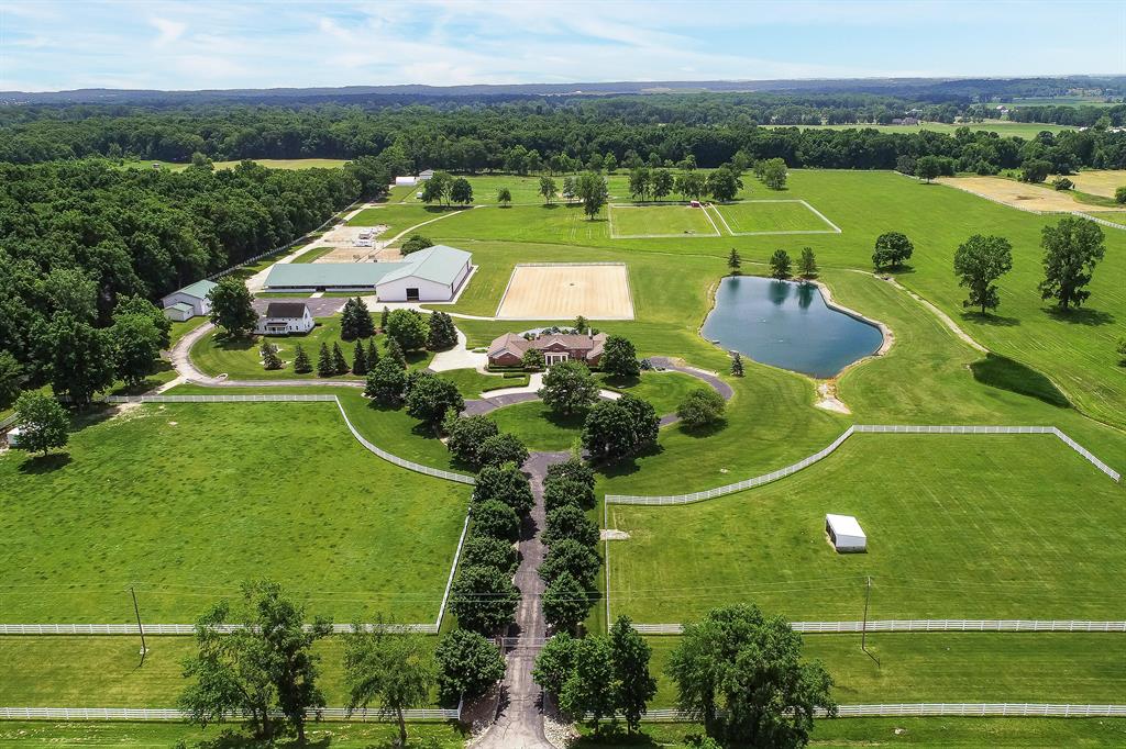 Welcome to an exceptional equestrian estate just 15 miles from downtown Ann Arbor, offering 62.5 acres of beautifully maintained land and first-class amenities. The stunning 3,561 sq ft main residence features a spacious, partially finished walkout basement and panoramic views of the surrounding countryside. A 1,964 sq ft guest house provides additional living space for visitors, caretakers, or multigenerational living.Equestrians will appreciate the 25-stall horse barn, 80x200 indoor riding arena with an attached observation room, multiple fenced pastures, and ample turnout space. An equipment barn and additional outbuildings provide room for storage, farm operations, or hobbies. A large pond adds to the property's serene setting, while a private helicopter landing padoffers unmatched convenience and accessibility. This one-of-a-kind property combines luxury, functionality, and privacyperfect for horse enthusiasts, hobby farmers, or those seeking a private country retreat near the city. WANT MORE INFO? Click the Virtual Tour link which has much more detailed information and an enhanced photo gallery! Do not go to the property without an appointment.