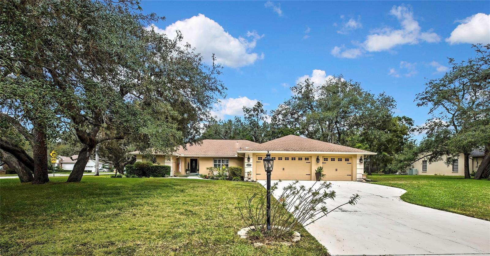 Welcome to Lake in the Woods, one of Spring Hill’s most desirable gated communities. This 3-bedroom, 3-bathroom pool home sits on a neatly landscaped corner lot and very open floor plan with 2,198 living square foot , along with a rare 3-car garage. The home has a 2025 water heater, 2022 AC unit. The split floor plan was designed for comfort and function. The primary bedroom is impressively spacious, featuring an upgraded ensuite with a soaking tub, glass walk-in shower, and dual vanities. Tile floors run throughout the main living areas for easy care, while the bedrooms have plush carpet for comfort.
The kitchen is a standout—bright, roomy, and thoughtfully laid out. With a breakfast bar, cozy breakfast nook, stylish tile backsplash, double oven, and abundant counter and cabinet space, it’s perfect for both everyday meals and hosting gatherings. The second bedroom is generously sized and sits beside the guest bath, while the third bedroom offers its own bath and direct access to the pool, making it ideal for visitors, in-laws, or a private office.
The screened saltwater pool is the centerpiece of the backyard, paired with a paved patio that provides plenty of room for outdoor dining and entertaining. Whether you’re enjoying a quiet evening or hosting friends, there’s space for it all. Inside, a large laundry room and the 3-car garage add the extra storage and convenience you’re looking for.
Lake in the Woods is known for its winding streets, mature trees, and natural beauty. Living here means you’re minutes from shopping, dining, and medical centers, while also close to local favorites like Weeki Wachee Springs, Hernando Beach, and the Gulf Coast. Outdoor activities, dining, and entertainment are always within easy reach.
This home brings together space, style, and a location that’s hard to beat in one of Spring Hill’s most sought-after communities.