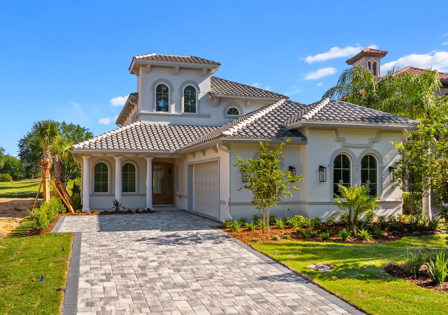 Under Construction. Don’t miss this rare opportunity to own a brand-new custom luxury home in The Conservatory at Hammock Beach—perfectly positioned on one of the last remaining golf and water view homesites. This exceptional two-story residence offers 3,041 square feet, 4 bedrooms, and 3 bathrooms, thoughtfully designed with timeless architecture and high-end custom finishes throughout. A grand entryway with a dramatic clerestory open-to-below design creates a striking first impression, immediately drawing in natural light and showcasing the home’s refined craftsmanship. Solid white oak flooring flows throughout the main living spaces, while expansive sightlines frame stunning views of the Tom Watson–designed golf course and water beyond. The open-concept layout seamlessly connects the living, dining, and kitchen areas—ideal for both relaxed daily living and effortless entertaining. At the heart of the home, the chef’s kitchen is both stunning and inviting, designed for gathering, hosting, and everyday enjoyment. Custom white oak cabinetry with soft-close dovetail drawers, decorative hardware, and custom cabinet lighting pairs beautifully with Taj Mahal quartzite countertops and premium GE Café appliances. An elegant custom dry bar with shelving and a bar refrigerator adds a layer of sophistication and convenience.Wake up to gorgeous golf and water views from your primary suite.  The spa-inspired primary bath elevates the experience with dual vanities, and an oversized walk-in shower featuring a freestanding soaking tub within the shower enclosure. Also located on the lower level are a library/office, a guest bedroom, full bath, and main-floor laundry, offering both convenience and flexibility. Upstairs, an expansive bonus room with sweeping golf course views opens to a beautiful balcony highlighted by a custom decorative railing—providing the same breathtaking scenery and an ideal space to relax or entertain.Every detail has been carefully considered, including custom built-out closet systems throughout, custom stair lighting, porcelain tile in all bathrooms, dual A/C systems, and a side-entry two-car garage. This home combines luxury with low-maintenance living. HOA fees include lawn care, irrigation, fiber-optic internet, and a manned security gate. Residents may enjoy optional access to resort-style amenities, including a clubhouse, pool, and fitness facilities.As an added bonus, this brand-new custom home includes a one-year builder warranty. Don’t just imagine it—be the first to live it! Schedule your private showing today.