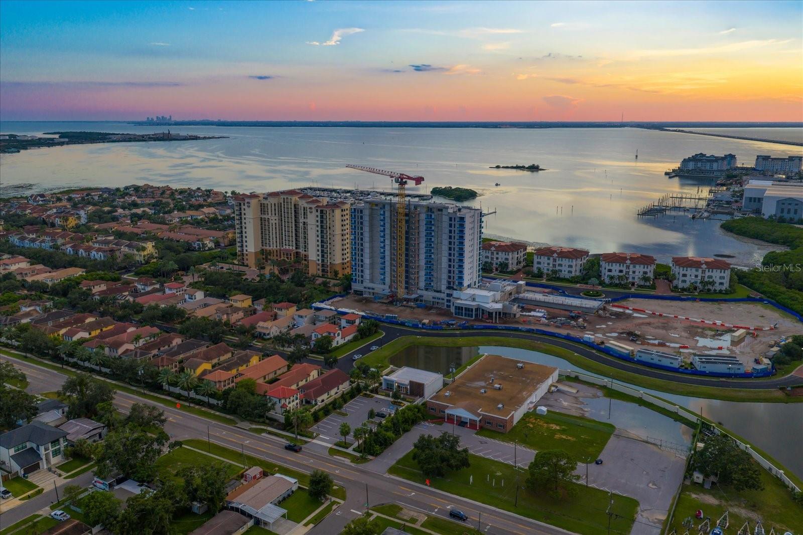One or more photo(s) has been virtually staged. Under Construction. Introducing AQUA at Westshore Yacht Club on the grounds of the exclusive gated waterfront community in South Tampa. Residence #1402 is a 2 bedroom, 2.5 bath plus a den with 2,319 Sq.Ft. Westshore Yacht Club’s newest residential tower: standing 17 floors, offering 77 luxurious condominium residences with sweeping sunset views and sunrise city views. Secure fob private elevator that opens into your private entry foyer. Interiors boast the finest finishes such as Italkraft premium cabinetry, quartz waterfall countertops, large format porcelain tile, Sub-Zero and Wolf appliances with induction stove top. Wide-open sun filled living and dining rooms with floor to ceiling windows and sliders accessing the West facing terrace, offering amazing sunset and Bay views. Generously sized Owner’s Suite enjoys 2 walk-in closets, spa-inspired Owner’s bath with large walk-in-shower and freestanding soaking tub, private lavatory enclosure, 2 separate vanity locations with premium fixtures. Amenity rich, the building features a rooftop sky pool with bay views and private cabanas, with breathtaking views of Old Tampa Bay, plus a 3rd floor pool with spa, outdoor grilling station and lounge area.  Spacious and elegantly appointed club room with conversational seating areas, sports lounge and billiard area and private dining room. State of the art golf simulator, theater with plush seating, private offices, children’s playroom and 2 fully furnished guest suites. Bay Front fitness center on the 17th floor with yoga and spin room. Climate controlled storage for each residence on the same level. Residents and guests will be welcomed by a valet attendant under the covered porte-cochere entrance leading to the residential lobby, with a signature ceremonial staircase that leads to the second floor lounge library. 24/7 staffed lobby, on site property manager and service personnel ensure an effortless lifestyle. Westshore Yacht Club is South Tampa’s premier unique Gated waterfront community, boasting the exclusive members-only Bay Club and Marina, 149 boat slips, two resort style swimming pools, outside Tiki Bar, and indoor fine dining, 806 Sunset bar, Day Spa, fitness center, community, and dog parks. All this and only 30 minutes to the beaches, 15 minutes to downtown Tampa and St. Petersburg, as well as Tampa and St. Pete Airports, and all the restaurants & shopping Tampa Bay has to offer. 
AQUA offers a stunning amenity package… Including free-flowing pools, private resident’s lounge, 3 rooftop sky pools, state of the art fitness, private screening room, pickleball in future phases and so much more! This indulgent lifestyle is all included at AQUA. Combining this with an optional membership to the Bay Club,  AQUA stands out as  one of the most enviable lifestyles in all of Tampa at a price point that can’t be matched by any other development in the Tampa area! For a limited time, Westshore Group is offering a 1 year membership to the Bay Club included in the price, as well as other incentives. Come and explore our sales gallery and take a tour of the last available site at Westshore Yacht Club… Discover the AQUA difference!