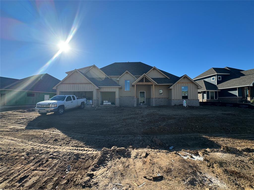 This Zade Bonus Room floor plan includes 3,105 Sqft of total living space, which features 2,850 Sqft of indoor space and 255 Sqft of outdoor living. This spectacular home offers 4 bedrooms, 3 bathrooms, a bonus room, a utility room featuring a utility sink, a mudroom, covered patios, and a 3-car garage with an in-ground storm shelter installed. The great room welcomes wood-look tile, a breathtaking cathedral ceiling with crows feet, a ceiling fan, a luxurious 3-panel sliding door with a 4' back patio extension, rocker switches throughout, and Cat6 wiring. The up-scale kitchen presents stainless steel appliances featuring a 5-burner cooktop and double ovens, 3 CM countertops, well-crafted cabinets to the ceiling with glass and lights in the uppers, cabinet hardware installed throughout, a corner pantry, decorative tile backsplash, more wood-look tile, exclusive pendant lighting, and a large center island equipped with a trash can pullout, dishwasher, and a spacious sink. The primary suite has a sloped ceiling detail with a ceiling fan, windows, carpeted flooring, and our cozy carpet finish. The primary bath includes a European walk-in shower with a rain shower head, a free-standing tub, a private water closet, a dual sink vanity with framed mirrors, 3 CM countertops, and a HUGE walk-in closet! Secondary bedrooms all feature high ceilings with a ceiling fan, spacious closets, windows, and carpeted flooring. Step outside to enjoy the covered back patio which offers a wood-burning fireplace, a gas line, and a TV hookup. Other amenities for this new build include our healthy home technology, a tankless water heater, a whole home air filtration system, R-44 insulation, and so much more!