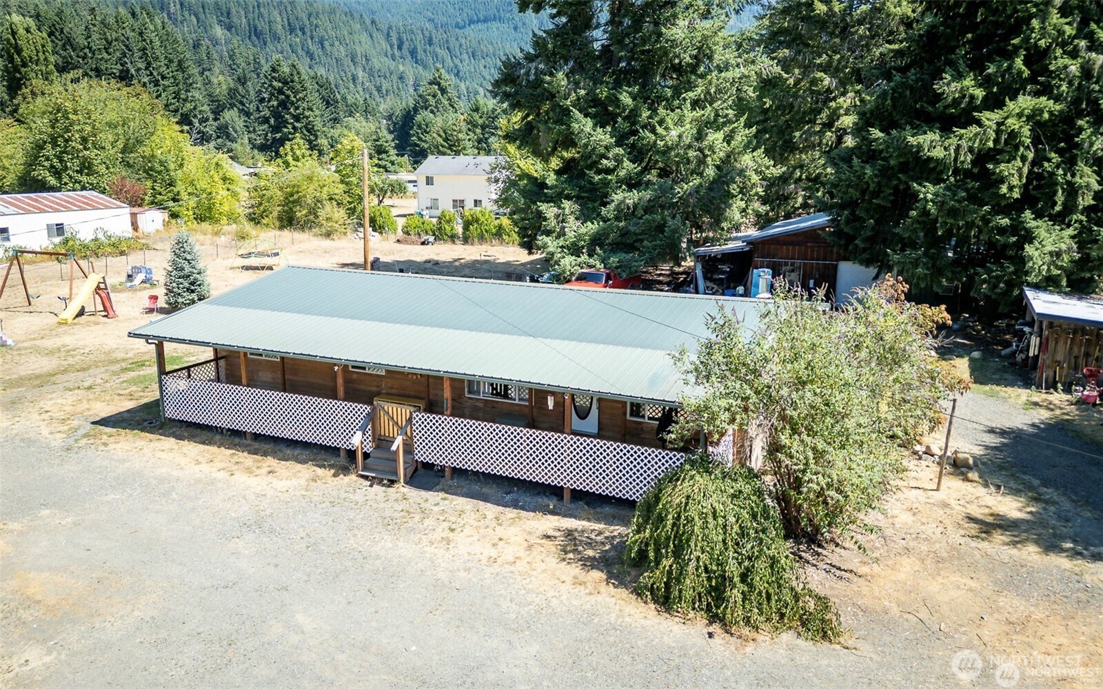 Welcome Home to a PRE-INSPECTED and ready for you Multi-generational opportunity. This is a 1.05 acre lot with options! The main home has 3 bedrooms, 2 bathrooms encased with beautiful cedar siding. Remodeled interior with cedar throughout the living and kitchen. Go out the back door you have a 24x36 shop outfitted with a new electrical panel. Next to the shop you have a detached, FULLY PERMITTED 1 bedroom, 1 bathoom w/ kitchenette. There's a RV pole with plenty of space to setup longterm. This property has 2 separate septics, a chicken coop, dog pen, wood storage with seasoned wood that conveys. After a long day, soak in the jetted jacuzzi with the lovely mountain as your backdrop. The lot is fully fenced with 2 entryways from the road.