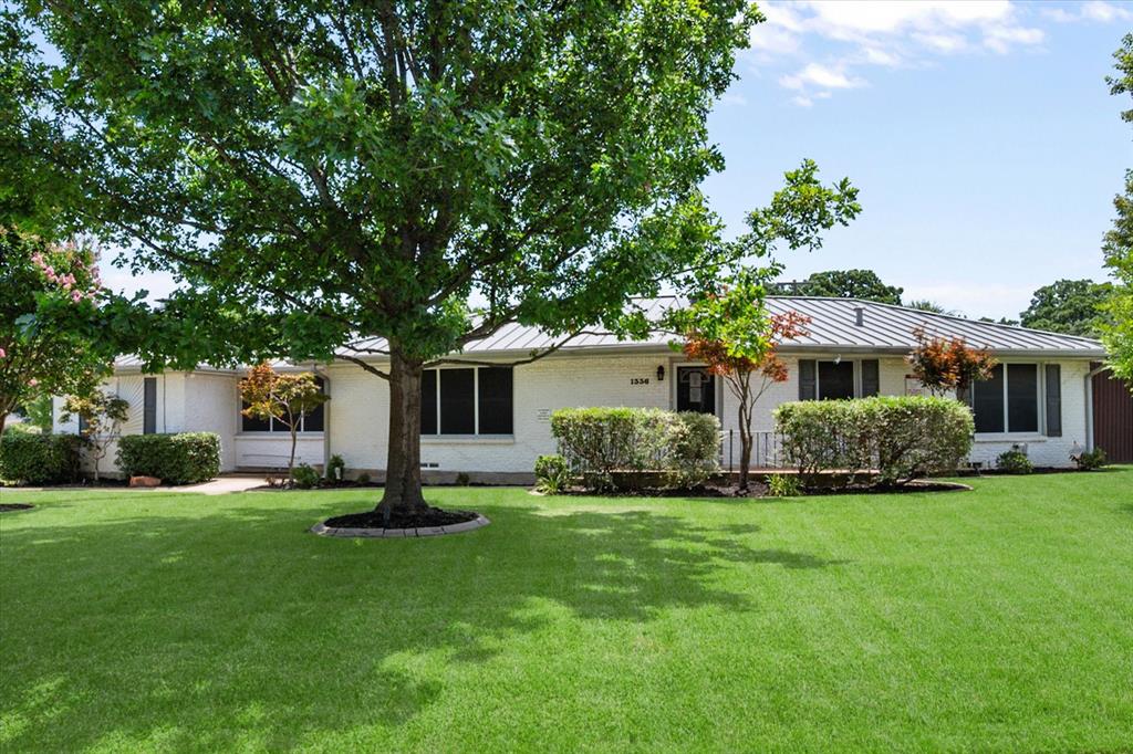 Welcome to your own private resort!  Main house is 3120 square feet.  Guest house is 1485 square feet.  Metal Shop is 1228 square feet.  This stunning single-story home on a spacious corner lot offers the perfect blend of luxury living and entertaining paradise. The main house has four generous bedrooms and two beautifully appointed bathrooms, and provides comfort for the whole family.  The heart of this home features a gourmet kitchen equipped with a built-in refrigerator, gas cooktop, double ovens and tons of counter space. The primary bedroom boasts a huge walk-in closet, sitting area, office & ensuite bath.  Step outside to discover your personal oasis. The backyard showcases a sparkling pool complete with a waterfall feature, surrounded by lush landscaping that transforms your outdoor space into a vacation destination. A charming cabana provides the perfect spot for poolside relaxation, while the outdoor kitchen and covered patio makes outdoor dining & entertaining effortless.  The property includes a versatile one story guest house, ideal for visitors or as a private retreat. Additionally, a practical workshop offers endless possibilities for hobbies, storage, or workspace needs. The sprinkler system maintains the landscaping with minimal effort.  Convenience meets luxury with six covered parking spaces and a circular front drive that creates an impressive arrival experience. Every detail has been carefully considered, from the exceptional outdoor entertainment areas to the functional indoor spaces.  Located near quality schools and convenient shopping at Tom Thumb, this home offers both tranquility and accessibility. This exceptional property redefines what it means to live well, combining everyday comfort with resort-style amenities in one remarkable package.