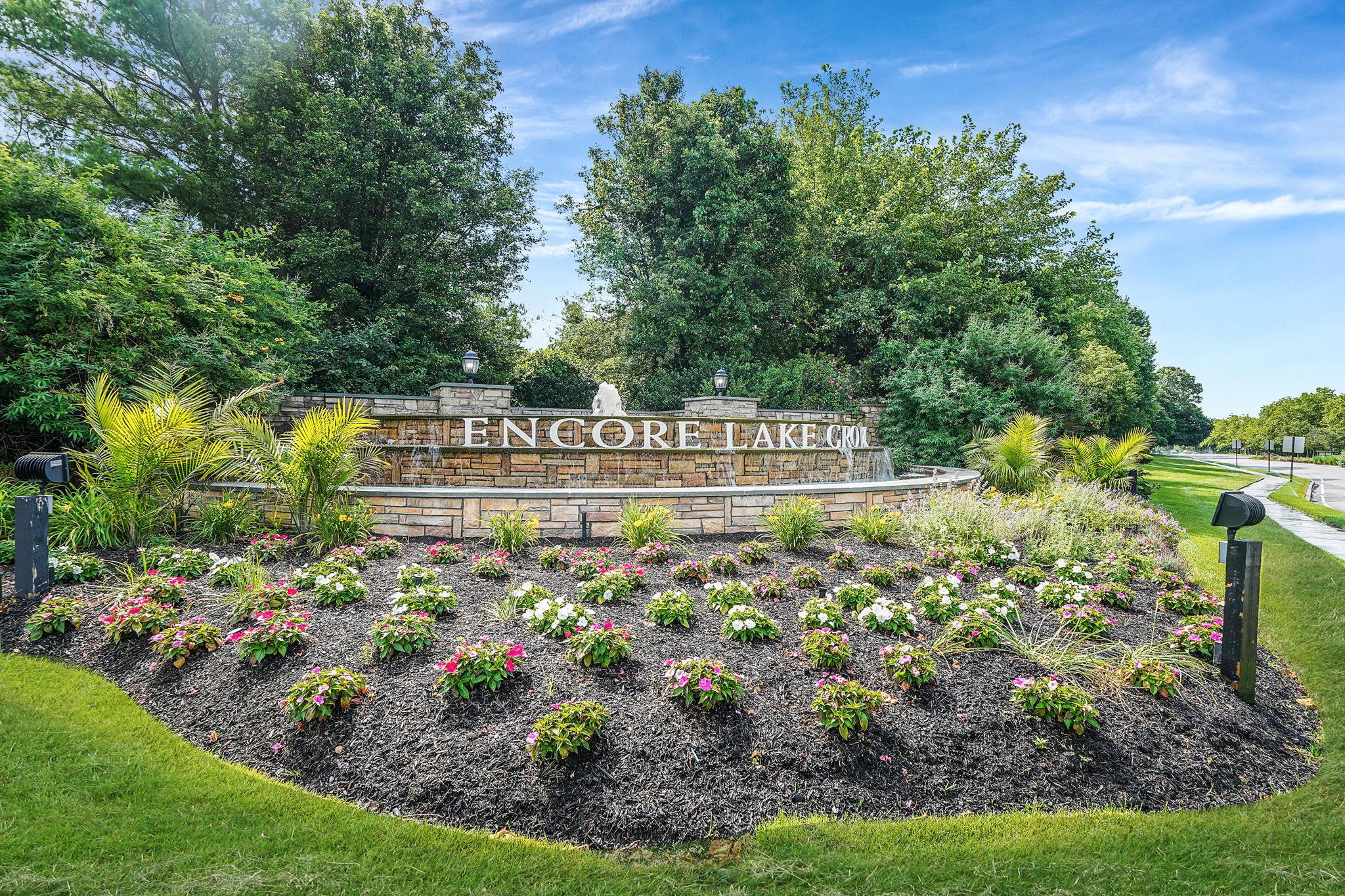 Come see this much sought-after 2 bedroom, 2.5 bath, lower unit in a cul-de-sac in fabulous Encore Lake Grove!! This super-clean ground floor unit with eat-in kitchen leading to walk-out patio, primary bedroom with en-suite bath on main level, oak hardwood floors, attached garage with driveway, provides a clean slate for the new owner. Encore is a luxury 55+ active lifestyle community that has it all!  The beautiful clubhouse - a true gathering place - boasts card rooms, billiard room, gym, indoor heated saltwater pool, saunas, and many events and clubs.  Outdoors are heated saltwater pool with hot tub, tennis and pickleball courts, putting green, bocce, shuffleboard, ping pong, fireplace, barbeque, sunny and shaded areas perfect for relaxing quietly/socializing.  Encore is a gated community with a 24-hour manned gatehouse.  Pets allowed.  Located across from Smithhaven Mall, Stony Brook Medical, Trader Joe's, Whole Foods, Costco, AMC Movie Theater, Lowe's, Marshall's, Wegman's, etc., and SO many restaurants!  IT DOESN'T GET BETTER, OR MORE CONVENIENT, THAN THIS!!
One time initiation fee - $3000.00 / Low annual Village tax - $278.32