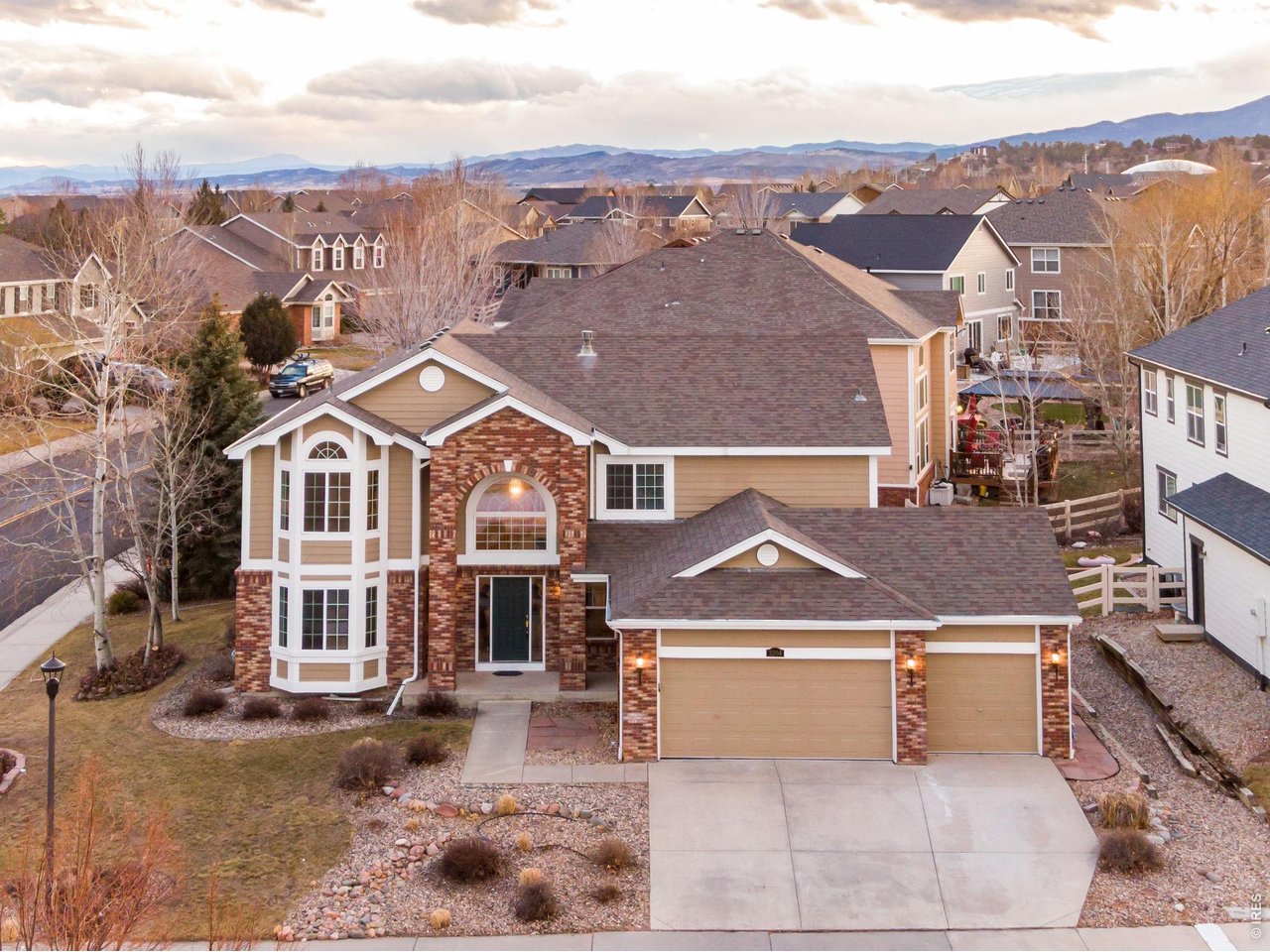 Incredible home located in NW Loveland, offering comfort, style, & prime location in one of Colorado's most desirable swimming pool communities. Come see why Loveland, Colorado is frequently voted as one of the best places to live or retire in America. Known as the City of Love, Loveland is the gateway to Estes Park & Rocky Mountain National Park, & offers outstanding restaurants, entertainment, breweries, community festivities, trails, parks, & recreation w/ something for everyone. This beautifully updated home welcomes you w/ a spacious foyer, new carpet w/ upgraded padding, fresh interior paint, & newly refinished hardwood floors. The main level features a formal dining area, a front living room or office w/ a bay window, & an impressive central staircase w/ catwalk. Double-pane windows, colonial doors w/ brushed nickel hardware, & quality finishes including rounded corners & knockdown texture. Family room offers vaulted ceilings, surround sound, gas fireplace, & an inviting open layout leading into the gourmet kitchen featuring all new appliances, double ovens, gas range, quartz countertops, backsplash, center island, breakfast bar, & pantry. A sunny breakfast nook opens to the patio, while the main floor includes laundry, a guest full bath, & a guest bedroom or office. Upstairs offers a split floor plan w/ a primary retreat featuring bay window, vaulted ceilings, walk-in closet, & a 5-piece bath, + 3 additional bedrooms including 1 w/ a private bath & walk-in closet. The basement includes floating floors, perimeter insulation, 4 windows, & rough-in for future bath. Mechanical upgrades include new central A/C & new Lennox furnace. The oversized 3-car garage includes workbench, storage, and patio access. Outside, enjoy a .1984-acre corner lot w/ mature landscaping, Trex decking w/ pergola, gardens, & flagstone patio. NO METRO TAX. Reach out today for a list of features, floor plan, or to schedule a private showing.