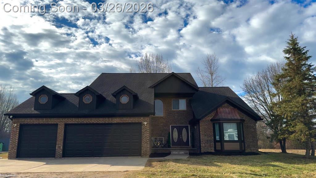 Beautifully updated brick split-level home situated on 10 private acres, set well back from the paved road for exceptional privacy. Conveniently located with easy access to I-94 just 7 miles away, while shopping centers and two medical hospitals are within 5 miles. Lake St. Clair is only 2.5 miles away an ideal location for lake lovers.  This spacious home features 4 bedrooms and 3 full bathrooms, including a primary suite with a walk-in closet and private walkout access to the deck. A convenient entry-level home office makes working remotely comfortable and practical. Hardwood floors add warmth and character throughout the main living areas.  The updated kitchen is designed for both everyday living and entertaining, featuring waterfall granite countertops, a matching granite dining room table, stovetop, and double oven. The dining area also offers walkout access to the deck, creating a seamless indoor-outdoor flow perfect for gatherings. The finished basement provides additional living and storage space, including a room with double closets ideal for organization, storage, or flexible use. Outside, the property is designed for outdoor living and recreation. Enjoy a large entertaining deck, volleyball court, and a private fishing pond.