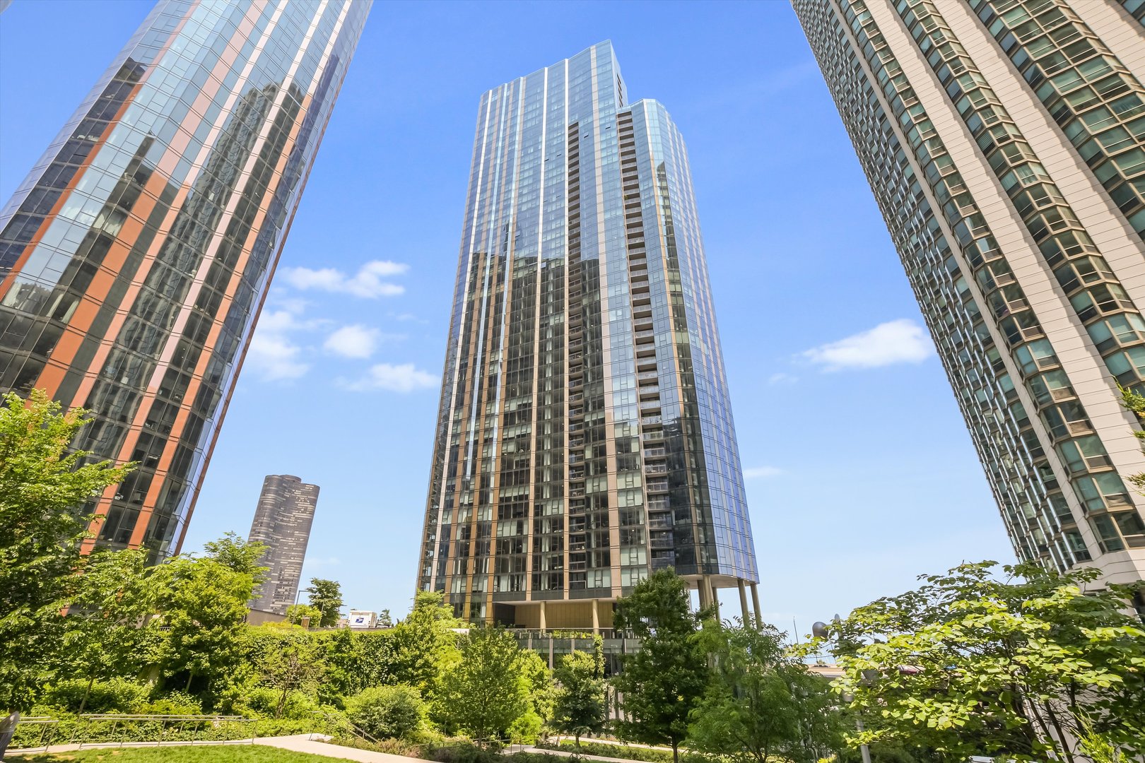 Lakeshore East's newest lakefront building, Cirrus Condominiums. Situated at the intersection where Lake Michigan meets the Chicago River. Cirrus is the crown jewel of Lakeshore East with 48,000 square feet of resort-style amenities. 4107 -- Interiors designed by Kaufman O'Neil include wide-plank, engineered, wood floors throughout, custom imported Italian cabinetry by Snaidero, Dornbracht fixtures, and quartz countertops. Panelized appliance package includes Gaggenau gas cooktop, integrated cabinet panel refrigerator and wall/speed oven, integrated cabinet panel Bosch dishwasher. Bosch full size washer and dryer. Incomparable resort-style and wellness amenities including indoor lap pool with hydrotherapy pool, state of the art fitness center, strength studio, motion studio all staffed by a wellness concierge with programmed fitness classes including yoga, Pilates and spin. The amenity space on the 41st floor has a spectacular terrace for outdoor entertaining including the lawn, fire pit, grilling station alfresco dining, and rooftop seating. Indoor entertaining includes a chef's table, demonstration kitchen, and a private dining room/wine lounge, all with in one-of-a-kind views of Lake Michigan, DuSable Harbor, and Navy Pier. Outdoor amenities include a pool with pool lounge, firepit, and grilling stations overlooking Lake Michigan. Kids enjoy their own indoor splash pad and kid's club. There are several work from home spaces, both private and conference rooms available, along with multiple lounge areas. Entertainment amenities include a soundproof jam room, movie in the screening room, billiards, shuffleboard, or simulated golf and sports screen and a maker's room. Cirrus is a pet friendly building with indoor dog run and pet spa along with the outdoor Bark Park. Condo could be sold for fully furnished for 625,000. There are only a couple of units with these high ceilings. The location of this unit is on the same floor as the outdoor terrace and grills.