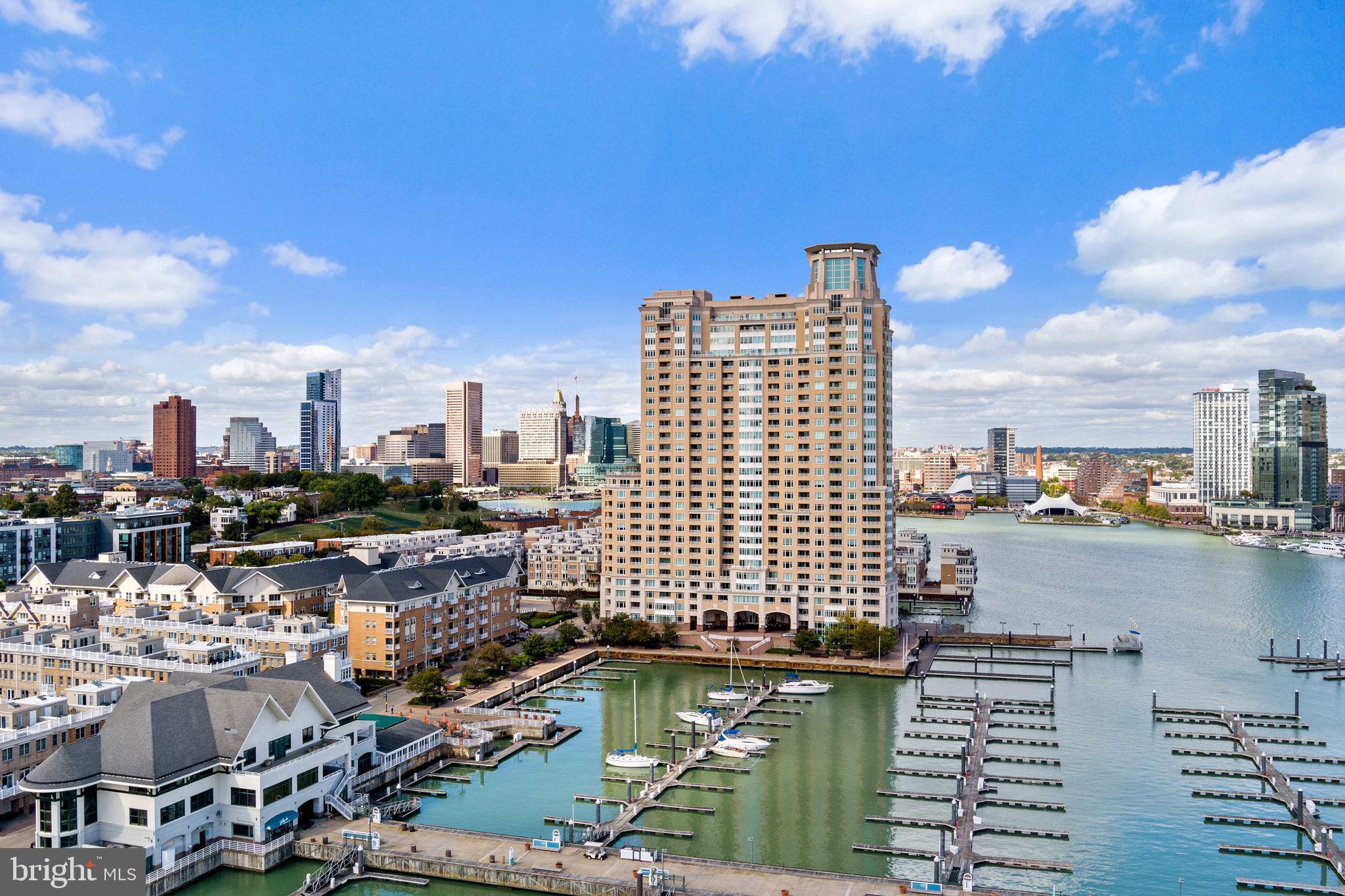 Experience Waterfront Living at Its Finest! Discover the perfect blend of comfort, style, and convenience in this beautifully designed 2-bedroom, 1.5-bath residence featuring breathtaking waterfront and city views. Step inside to a bright, open living room adorned with crown molding, elegant track lighting, and a stunning bay window that floods the space with natural light. The dining area and kitchen flow seamlessly together, complete with a pantry and direct balcony access—ideal for enjoying morning coffee or sunset views over the water. A convenient half bath and in-unit laundry enhance everyday comfort and functionality. The primary suite is a true retreat, offering balcony access, a spa-like ensuite with jetted tub and separate shower, plus a walk-in closet for ample storage. The versatile second bedroom is perfect for guests, an office, or a peaceful personal space. Enjoy resort-style amenities, including a 24/7 concierge, a 50-foot lap pool, children’s wading pool, hot tub and spa, sauna, steam room, massage facilities, and a fully equipped fitness center. Exterior features include garage parking and a scenic waterfront walkway—perfect for jogging or leisurely strolls. This is your chance to own a home that captures the best of modern living with panoramic water and city views—all in one unbeatable location!