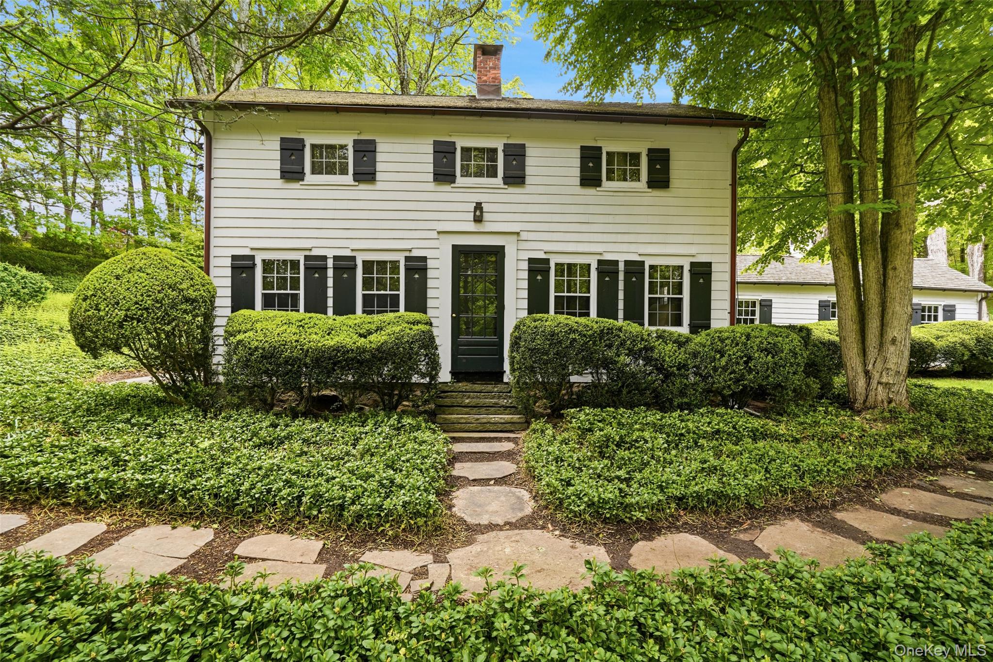 SNUG HIll. Step into the past! Rare opportunity to acquire one of Pound Ridge’s Landmark antiques. Handsome 1860 Colonial, a former Hoyt Homestead. Incredible period details including aged Chestnut floors, raised paneling and a stone fireplace. Beautiful Living Room with fireplace. Formal Dining Room with chair rail.  Renovated Kitchen with custom cabinets and updated appliances. Two, potentially three, Bedrooms. One and one-half Baths. Two picturebook acres with rolling lawns, spectacular trees and old stone walls in the heart of Pound Ridge. Flowering perennial garden. Detached Garage with Potting Shed. Moments to Scotts Corners, the town park, and historic hamlet. An incredible offering!
