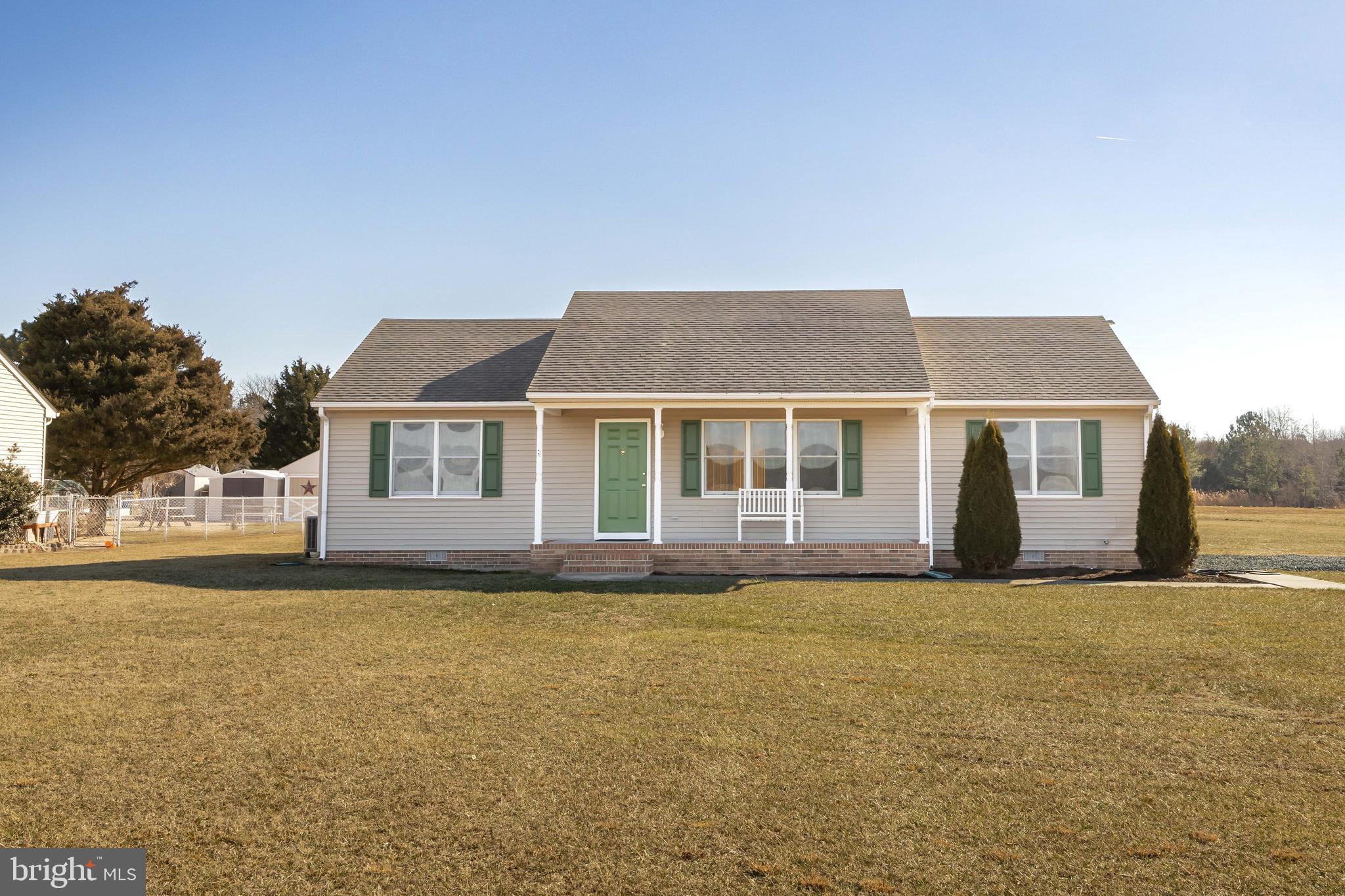 Lovely remodeled rancher on large 1.78 lot in country setting.  Welcoming front porch (6x22) opens into the large living room with cathedral ceiling.  Three bedrooms, 2 bathrooms, kitchen with dining area plus a separate laundry room.  Plenty of windows make the house bright and provides nice views to the rural countryside.  Attached 12 x 12 rear deck with new deck boards. New appliances include the refrigerator, microwave, dishwasher, washer and dryer.  Recent upgrades also include a new heat pump (2023), new bathroom vanities with faucets, new kitchen countertop, new light fixtures and paddle fans, new carpeting and LVP flooring with everything freshly painted and ready for move in. Vinyl siding and Andersen windows makes exterior maintenance easy.  Huge lot extends back into the woods in the rear.  Two pad sites installed, one for garage/barn and one for a shed.  The septic system has been recently pumped out and has passed inspection.