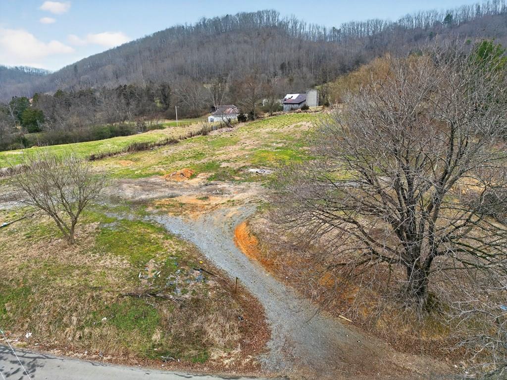 Excellent opportunity to own two recently cleared parcels in Washington County, Virginia, offering privacy, convenience, and flexible use. The combined offering includes two tracts totaling approximately 1.54 acres, providing ample space for residential development or investment.  Both parcels feature public water taps already in place, and the larger parcel is equipped with an existing septic system—significantly reducing upfront development costs. The property is zoned A-1, allowing for a variety of uses, including manufactured homes.  A graveled entrance is already in place, and the recent clearing enhances usability while still maintaining a private, peaceful setting. This is an ideal opportunity for buyers seeking a build-ready property with utilities in place and room to grow.  A rare find with infrastructure already completed—bring your plans and start building.  Red property boundaries shown in photos are an approximate representation of boundaries, exact boundaries are per deed.  Septic documentation available for review.
