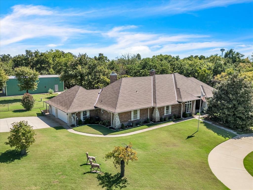 Wow! Where to even begin. First of all, this is a rare and loved property on 1.46 acres in a unique neighborhood nestled in the trees. Easy access to all points of central OKC. Let’s start with the update Pella Windows. New roof in 2021. New gas line in 2021. The incredible barn/RV storage has been rewired with an updated electric panel. It is 25’x50’x14’tall, 12’ overhead door. Concrete slab, insulated and has water. Built-in shelving and a loft for excellent storage. Built-in doggy door for large dog and well ventilated. Bear Safe to remain with home bolted in the oversized 3 car attached garage. Tankless water heater. The nicest hickory wood floors there are and two masonry stone fireplaces. Storm cellar. Updated spacious kitchen with granite counters and double ovens. Living area off kitchen has a wet bar tucked just around the corner. Remodeled primary bathroom. Doors from your primary bedroom to a beautiful deck in a lush setting. All bedrooms with attached full bath and a walk-in closet. Not one but 2 tankless water heaters. All this on one level with no HOA. City of Edmond will be doing a paving update very soon.