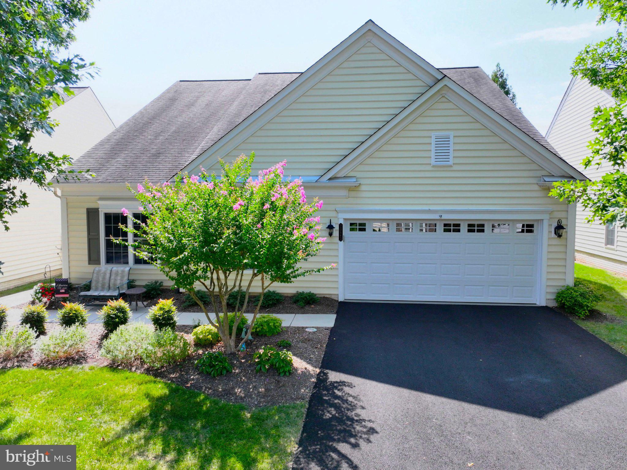 This residence boasts an impressive 2,150 sq. ft. of meticulously maintained living space, all on one level!  It's the largest single level floorplan in Potomac Green!   There are 3 bedrooms and 2 full baths, plus an oversized 2 car garage.  Step inside to find a gourmet kitchen adorned with upgraded countertops, a spacious breakfast area, and a family room that invites gatherings. The primary suite features a luxurious bath and a generous walk-in closet, while the cozy gas fireplace adds warmth to the living area, perfect for relaxing evenings. The owners recently invested $20,000 in beautiful new hardwood and porcelain tile floors! Enjoy the outdoors with beautifully landscaped front and rear yards, complete with a patio for entertaining. No need to mow your lawn - the HOA does it for you!  The community offers an array of amenities, including indoor and outdoor pools, a fitness center, tennis courts, and walking paths, ensuring an active and engaging lifestyle. Conveniently located near major transportation routes and just minutes from shopping and dining, this home is not only a sanctuary but also a gateway to a vibrant community. With a security gate and maintenance-free living, you can enjoy peace of mind and focus on what truly matters - creating memories. Don't miss this opportunity to embrace a fulfilling lifestyle in an active adult community that caters to your needs. Schedule your private tour today and experience the charm of Potomac Green!