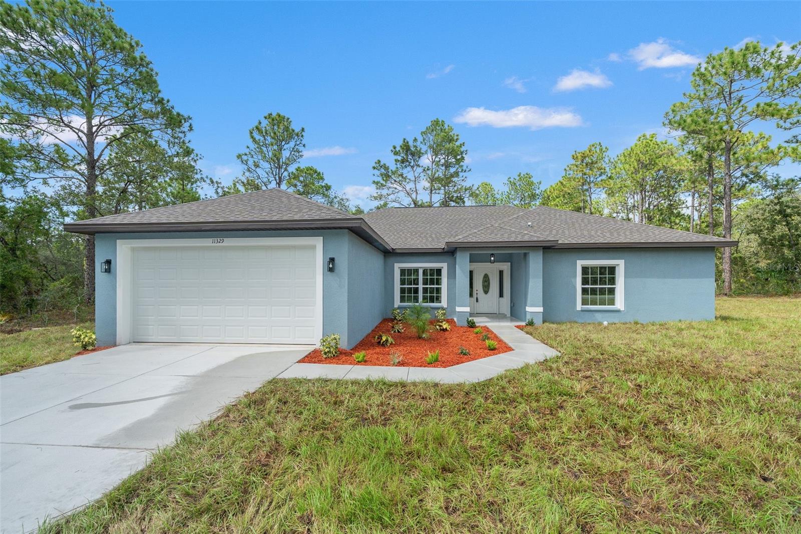 Welcome to this stunning brand-new 4 bedroom, 2 bath, 2 car garage home perfectly situated on a spacious .59-acre lot in one of the area's most sought-after neighborhoods. Designed with comfort and style in mind, this home features open layout with a split bedroom plan, high ceilings, oversized bedrooms, and walk-in showers in both bathrooms. The chef's kitchen is a showstopper with white shaker cabinets, granite counters, stainless steel appliances, breakfast bar, and a pantry. A dedicated laundry room with a sink and matching shaker cabinets adds convenience and function. Throughout the home, you'll find beautiful ceramic tile flooring that blends durability with modern design. Enjoy seamless indoor-outdoor living with French doors leading to an oversized patio, perfect for entertaining or relaxing while overlooking your spacious backyard. All of this is just minutes from shopping, dining, the Gulf Coast, the Weeki Wachee River, and the Chassahowitzka Wildlife Management Area, offering endless opportunities for recreation and adventure. Don't miss the chance to own this move-in ready, beautifully appointed new construction home! Schedule your private tour today!
