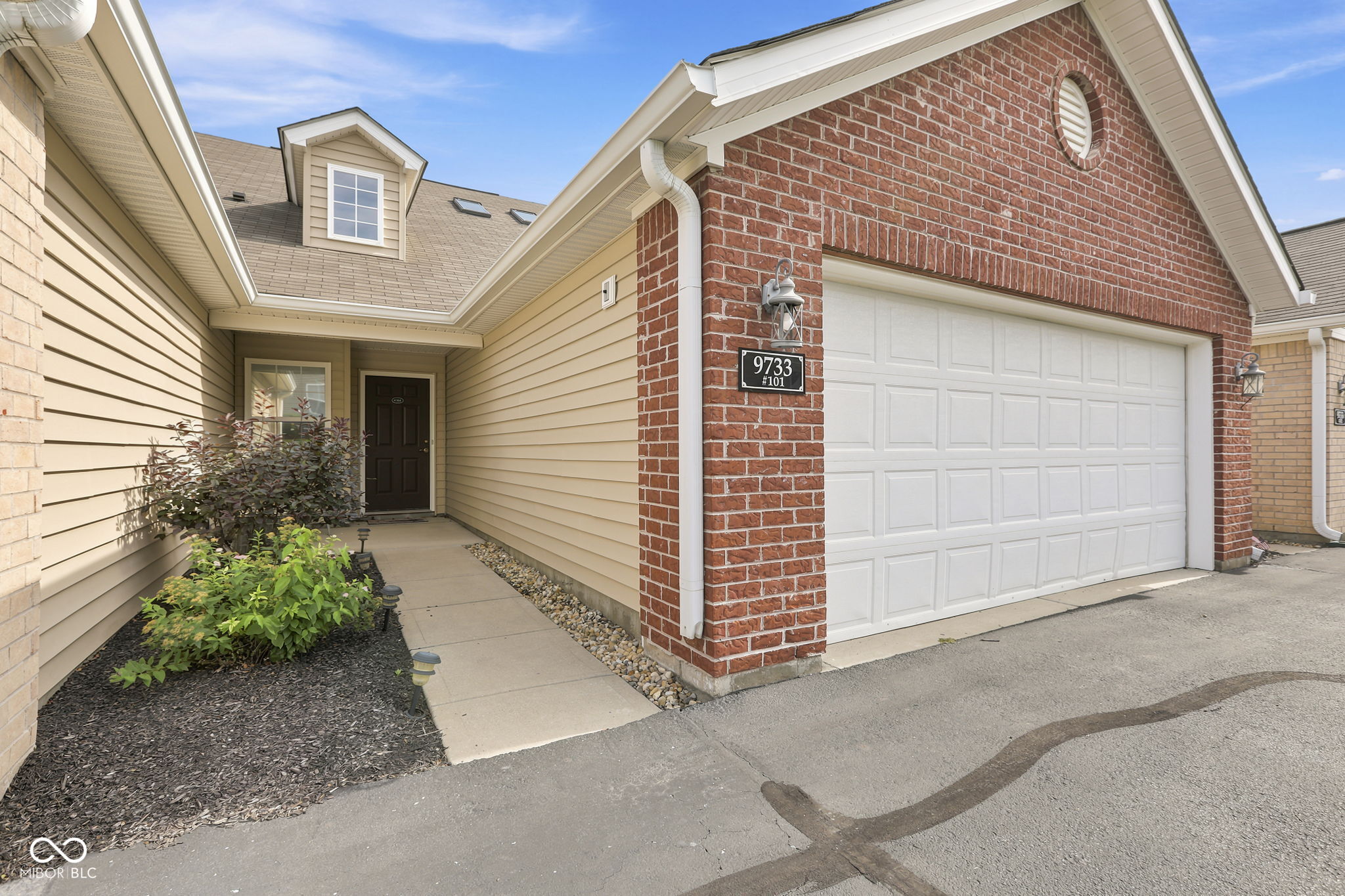 Welcome home to easy, low-maintenance living in the heart of Fishers! Built in 2016 and exceptionally well maintained, this move-in ready attached home offers the perfect blend of comfort, convenience, and style. Inside, you'll find fresh paint, brand-new carpet, and an inviting open floor plan featuring 2 bedrooms, a versatile loft ideal for a home office, hobby space, or guest retreat, and a cozy fireplace that anchors the main living area. The kitchen is beautifully appointed with quartz countertops, ample cabinetry, and all appliances included. A new water heater, water softener, and included washer and dryer make moving in effortless.  Enjoy quiet space on the small covered front porch or unwind on the rear patio. Best of all, the HOA takes care of exterior maintenance and lawn care, so you can spend more time enjoying everything Fishers has to offer. The location is hard to beat-just minutes from The Yard, Topgolf, IKEA, shopping, dining, entertainment, parks, and everyday conveniences. Quick access to I-69 and other major thoroughfares makes commuting a breeze. As an added bonus, the community is currently in the process of adding a gated entrance, enhancing both privacy and curb appeal. Whether you're looking for your first home, downsizing, or simply seeking a carefree lifestyle in one of Fishers' most convenient locations, this home checks all the boxes.