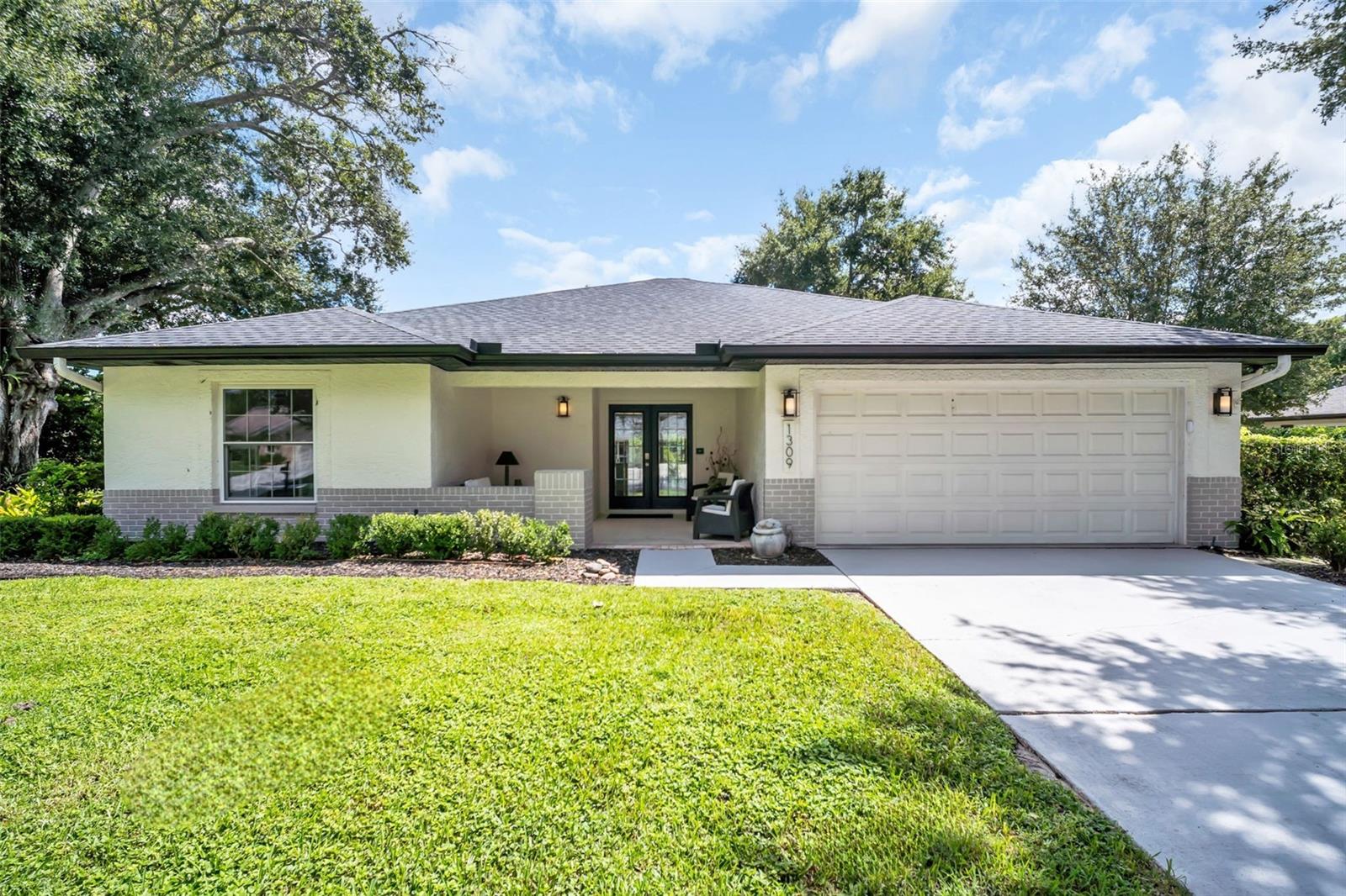 Beautifully renovated 2-bedroom, 2-bath POOL home with nearly 1,700 square feet in Palm Harbor’s premier 55+ golf community, Highland Lakes! From the moment you arrive, the freshly painted exterior, new sod, 2024 ROOF, and stunning glass double-door entry set the tone for this beautifully updated home. Step inside to a bright, open floor plan with immediate pool views through three massive glass sliding doors. The freshly painted interior features recessed lighting, multiple skylights, ZERO popcorn ceilings, newer ceramic tile throughout the main living areas, and new 2025 carpet in both bedrooms. The beautiful kitchen is the heart of the home, offering granite countertops, updated cabinetry, sleek 2023 stainless steel appliances, a cozy breakfast nook, large pantry closet, and convenient access to the 2-car garage. The spacious primary suite is a true retreat with private pool views, a massive walk-in closet, and beautifully remodeled en-suite bath featuring a glass-enclosed walk-in shower, new vanity with stone countertop, and recessed lighting. The second bedroom offers an additional large walk-in closet and built-in desk, making it an ideal guest suite or flexible space, and is conveniently located next to the fully remodeled hall bath with tub/shower combination. Step outside to your own private Florida oasis! The screened and enclosed pool and spa provide the perfect setting for year-round entertaining and relaxation, while lush surrounding landscaping creates added privacy and peaceful views. A spacious patio area beyond the pool screen provides additional room for outdoor furniture and grilling, while the separate screened golf cart garage offers exceptional storage and convenience. Additional highlights include a NEW 2024 ROOF, cost-saving deep irrigation well, and a desirable non-flood zone and non-evacuation zone location! This truly turn-key home is ready for you to move in and immediately begin enjoying the Florida lifestyle! As a Highland Lakes resident, you’ll enjoy FREE UNLIMITED GOLF on three private executive golf courses, along with an active clubhouse featuring social events, clubs, fitness programs, and hobby activities. At Lake Tarpon Lodge, residents also have access to a second heated pool, picnic areas, fishing pier, community pontoon boats, and secure RV and boat storage—all included with your membership. With stylish renovations, spacious living areas, a private pool and spa, and an exceptional array of amenities, this home offers the perfect combination of comfort, convenience, and the vibrant Highland Lakes 55+ lifestyle. Stunning pool homes in Highland Lakes aren't available often - don't wait and schedule your private showing today!