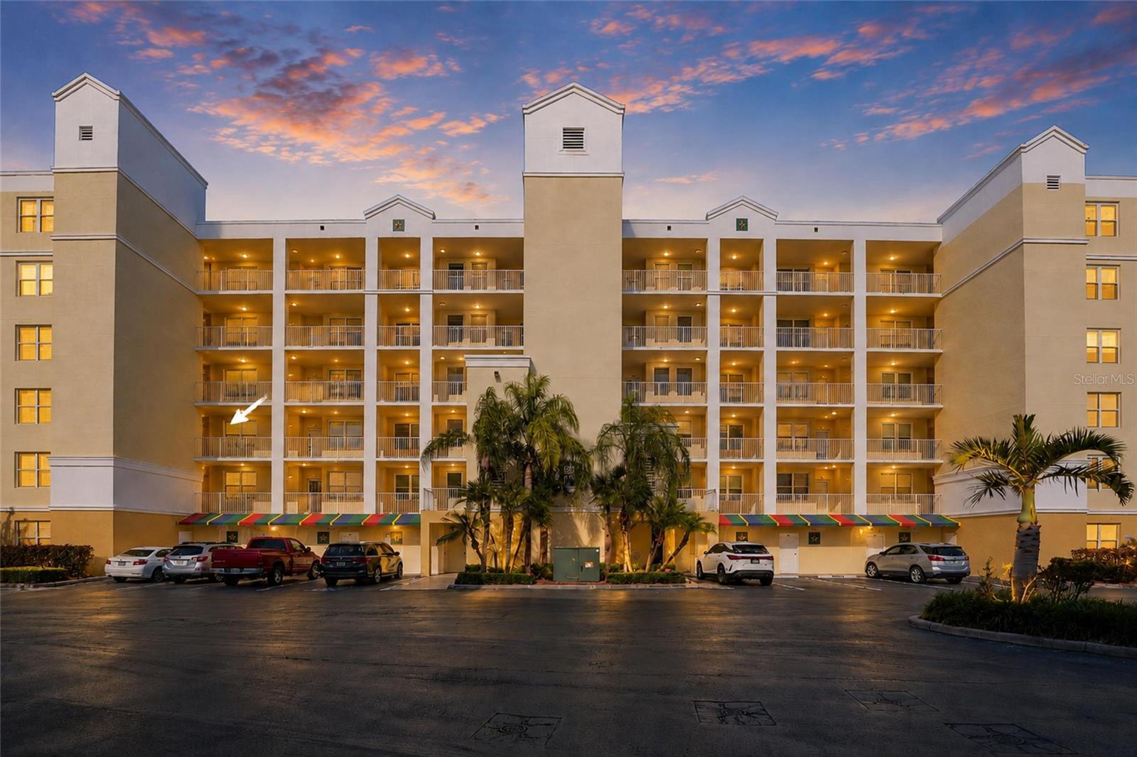 Welcome to one of Largo’s hidden gems, Country Club Condominiums at East Bay, where peaceful golf course surroundings, spacious living and a central Pinellas County location come together beautifully. This second floor corner condo offers an impressive 1,800 square feet with 3 bedrooms, 2 bathrooms, a private oversized garage and a screened lanai overlooking the lush, park like setting.  Step inside and you’ll immediately appreciate just how much space this home offers. The expansive living and dining areas are filled with natural light and provide plenty of room for both everyday living and entertaining. The spacious kitchen features white cabinetry, stainless steel appliances, generous counter and storage space, a breakfast area and an easy connection to the main living areas.  The split bedroom floor plan provides privacy for both owners and guests. The generous primary suite is tucked away from the secondary bedrooms and features two walk in closets and a private ensuite bath. The third bedroom, complete with built ins, offers wonderful flexibility as a bedroom, home office, den or hobby space. An oversized laundry room and abundant closet space throughout the condo provide the kind of storage rarely found in condo living.  One of the best features may be just outside. Step onto the private screened corner lanai and enjoy peaceful views surrounded by freshwater lakes, mature landscaping, golf course green space and Florida wildlife. It is an ideal place to start your morning with coffee or unwind at the end of the day.  Elevator access is conveniently located near the oversized under building garage, offering additional storage along with plenty of open guest parking. Country Club Condominiums is an intimate community of just six buildings with a pool, spa and clubhouse, all surrounded by beautifully maintained grounds adjacent to East Bay Golf Course.  With no age restrictions and a location convenient to shopping, dining, parks, airports and some of Florida’s most beautiful Gulf beaches, this is an opportunity to enjoy the space and storage of a single family home with the convenience of condo living. Come discover why Country Club Condominiums at East Bay feels like a peaceful retreat right in the heart of Pinellas County.