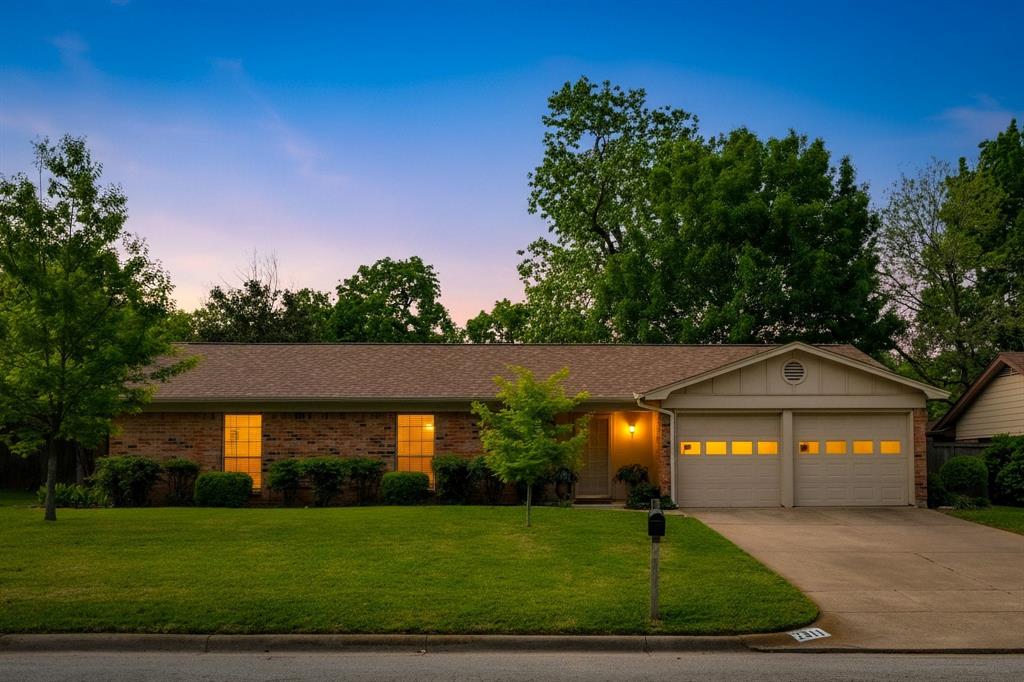 Multiple offers Received. BEST & FINAL OFERS DUE MONDAY 4-13 by 5 pm Charming cottage-style home in well maintained neighborhood is ideally located near HWY 121, offering both convenience and easy access to shopping, DFW Airport and more! This well-maintained property has been thoughtfully updated over the years, including a roof replacement in 2023, fresh interior paint, and popcorn ceiling removal completed in 2026. The kitchen features new appliances installed in 2026, creating a refreshed and functional space for everyday living. The inviting floorplan includes a spacious dining area just off the kitchen, which flows effortlessly into the large living room featuring a raised hearth fireplace and a wet bar—perfect for entertaining or relaxing evenings at home. All bedrooms offer generous closet space and feature new carpet installed in 2026, providing comfort and a fresh, move-in ready feel.Step outside to a beautifully landscaped backyard retreat, complete with an expansive covered patio, ideal for outdoor living. The numerous raised garden beds create a wonderful opportunity for gardening enthusiasts to grow flowers, herbs, or fresh produce, adding both beauty and enjoyment to everyday life. Surrounded by mature shade trees, this outdoor space offers a peaceful setting perfect for unwinding, entertaining, or simply enjoying the rewards of your own garden. Other updates and upgrades include full sprinkler system, Updated fence and some new lighting.