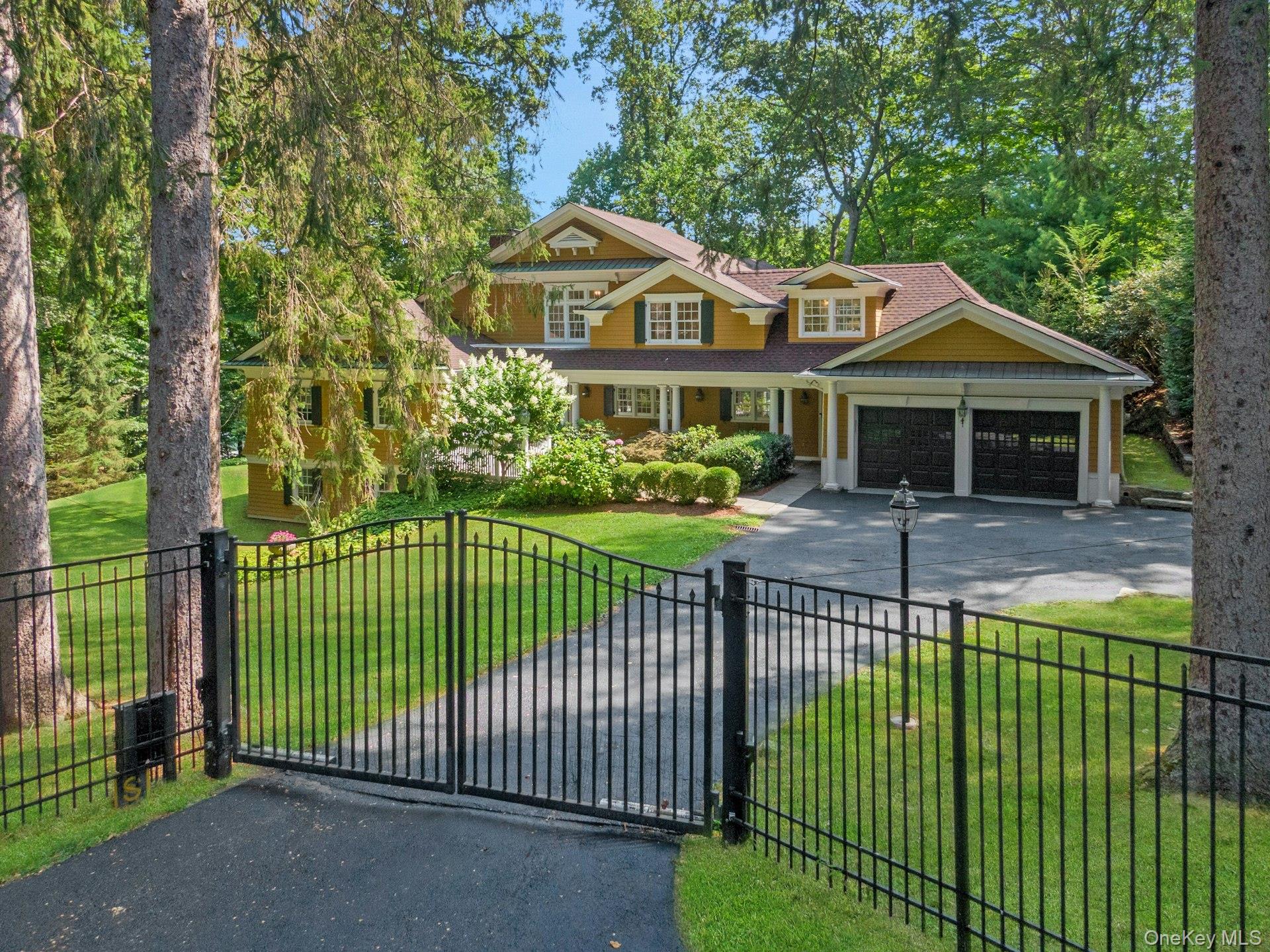 A dazzling opportunity to own an epic property in Armonk’s coveted Windmill Farm community, privately set behind its own gate on 1.2 acres. This rare North Lake waterfront home offers just under 5,300 sq ft of living space and over 220 feet of shoreline on 22-acre North Lake, with a private dock for swimming, boating, and fishing, plus spectacular views from almost every room. A lovely, gently sloping lawn stretches from the house to the water’s edge, creating a serene, park-like setting.
Thoughtfully custom-built with quality finishes, the home features a charming rocking chair front porch, sun-filled open spaces, and a comfortable flow ideal for both lively entertaining and everyday family living. Two stone patios overlook the lake—perfect for summer gatherings—while a beautiful balcony off the primary bedroom is an inviting spot to enjoy your morning coffee or a good book. A sandy beachfront invites you to build sandcastles, sink your toes in the warm sand, and savor the simple joys of lakefront living. From summer kayaking to winter ice-skating, every season offers a new way to enjoy this one-of-a-kind setting—just minutes to Byram Hills schools, downtown Armonk, and Metro-North, and only an hour from NYC.