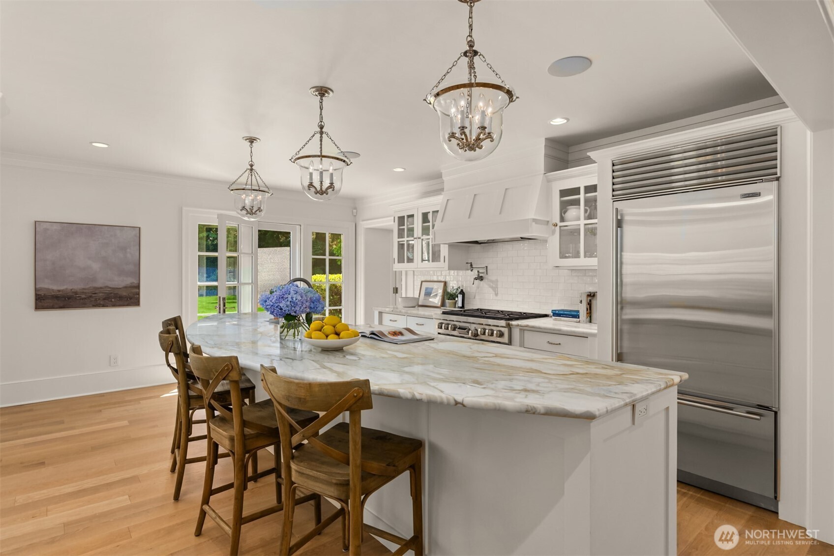 Well-appointed kitchen centered around a generous island.