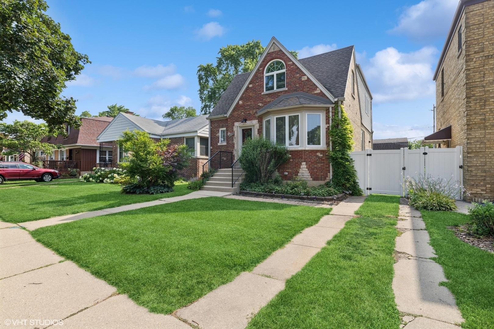 This beautifully remodeled brick English Tudor home with full addition combines timeless character with modern updates. Step inside to an open and inviting layout, featuring gleaming hardwood floors,  customized, high end cabinetry in kitchen and baths, SS appliances, abundant natural light, and contemporary finishes throughout-perfect for both everyday living and entertaining.  This home offers 4 spacious bedrooms plus a versatile 5th bedroom in the fully finished basement-ideal for guests, a home office, or a workout space. The finished basement also includes a large recreation room, half bath, and plenty of storage, creating a comfortable extension of the living space. Outside, you'll find a fully fenced yard that's perfect for kids, pets, or private gatherings. A 2+garage with a party door opens seamlessly to the yard, making outdoor entertaining a breeze. There is a loft space in the garage for additional storage space. The adjacent patio area provides the perfect spot for summer barbecues.  Close to Edison Park restaurants, parks, bars, and entertainment. Walking distance to St. Juliana, Frederick Stock Elementary, and Ebinger Elementary. With its classic brick exterior, updated interior, and inviting outdoor spaces and perfect 10+ location, this move-in ready home combines charm, functionality, and lifestyle.