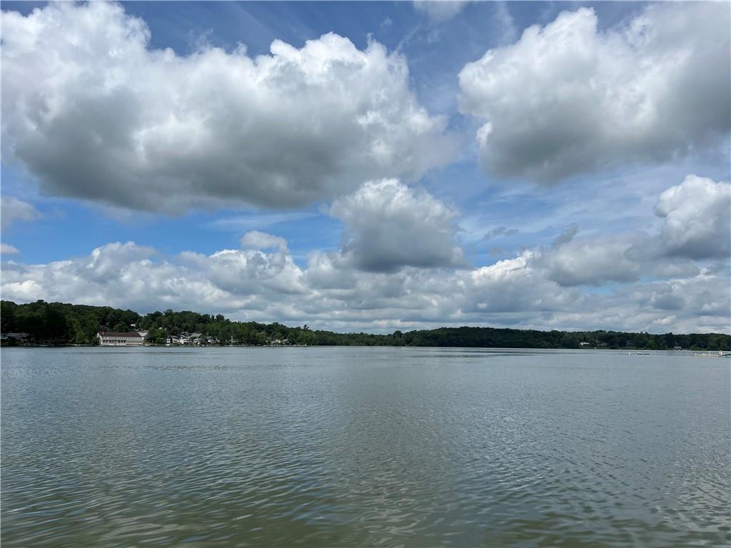 Enjoy year-round water views from this sunny and beautifully maintained two-bedroom cottage on Peach Lake—one of the few remaining lakes in the area that permits motorized boating. This charming home offers easy one-level living, featuring an oversized living room with cathedral ceilings and a pellet stove for cozy winter nights. The eat-in kitchen is updated with granite countertops, stainless steel appliances, and sliding glass doors that lead to a paved patio overlooking the canal. Perfect spot to relax and enjoy your morning cup of coffee.  The primary bedroom includes his-and-hers closets, while the second bedroom is comfortably sized. The updated full bathroom also houses a stacked washer and dryer for added convenience. Hardwood floors throughout add warmth and character. A shared dock allows for easy launching of your motorboat or jet skis, making lake life effortless. The Peach Lake community offers a wealth of amenities, including a private beach, picnic area, playground, basketball court, softball field, and clubhouse. Located just minutes from I-684, I-84, and Metro-North, with golf courses, an equestrian center, restaurants, and shopping nearby. Come and enjoy lakeside living at its best!

Please note: Co-op board application and approval are required.