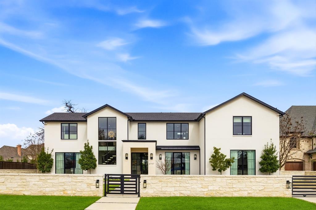 Experience sophisticated living in this exceptional Preston Hollow residence, set on an expansive 100x165 lot. Designed for both style and function, the open-concept floor plan is highlighted by expansive windows, high-end finishes, custom window coverings, designer fixtures and stunning hardwood and marble floors. The main level showcases a stunning  two-island kitchen complete with a Sub-Zero refrigerator, Wolf range, and prep kitchen, all flowing seamlessly into the formal dining room. A spacious living room with a striking see-through fireplace creates an inviting focal point. The oversized primary suite offers a private sitting area and fireplace, along with a luxurious ensuite bath with dual vanities, a walk-in shower, garden tub, and an impressive walk-in closet. A breakfast area with a dry bar and wine fridge, private office, powder bath, and laundry room complete the first floor. Upstairs, four generously sized secondary bedrooms, each with ensuite baths and walk-in closets, are accompanied by a media room and an additional utility room. Outside, the beautifully designed backyard is ideal for entertaining and everyday living, featuring a sparkling pool, covered patio and cabana, a full pool bath, turfed play area and a built-in grill. Additional highlights include a four-car garage with ample storage, gated front driveway, custom Savant-powered smart home and multimedia system, theater-quality surround sound systems, interior and exterior Nest cameras throughout, and fully integrated lighting and thermostat controls. Ideally located within walking distance to shopping and dining at Preston Royal Shopping Center, this one-of-a-kind home offers the very best of Preston Hollow living.