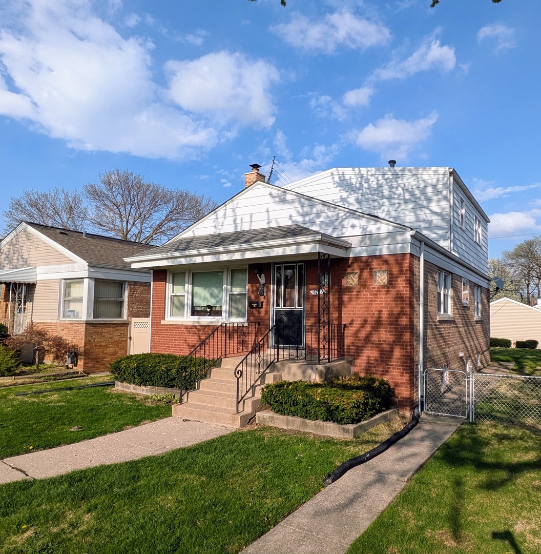 Great Opportunity to move into the Garfield Ridge Neighborhood of Chicago!  This true 2 story home features solid brick construction and a LARGE lot.  Inside you will find a classic layout on the first floor with hardwood floors, spacious living room, separate dining room, first floor bedroom, and kitchen.  The second floor features a large master bedroom with WALK-IN Closet, and a shared master bath!  The 2nd floor also features the third bedroom.  The home also features a full basement with an additional half-bath, newer sound insulating windows (2017), tear off roof (2017), leaf-guard gutters (2021), hot water tank (2024), A/C (2024).  In the back you will find a large well maintained zoysia lawn and a 2 1/2 car garage. Limited showing times available -  ESTATE SALE.