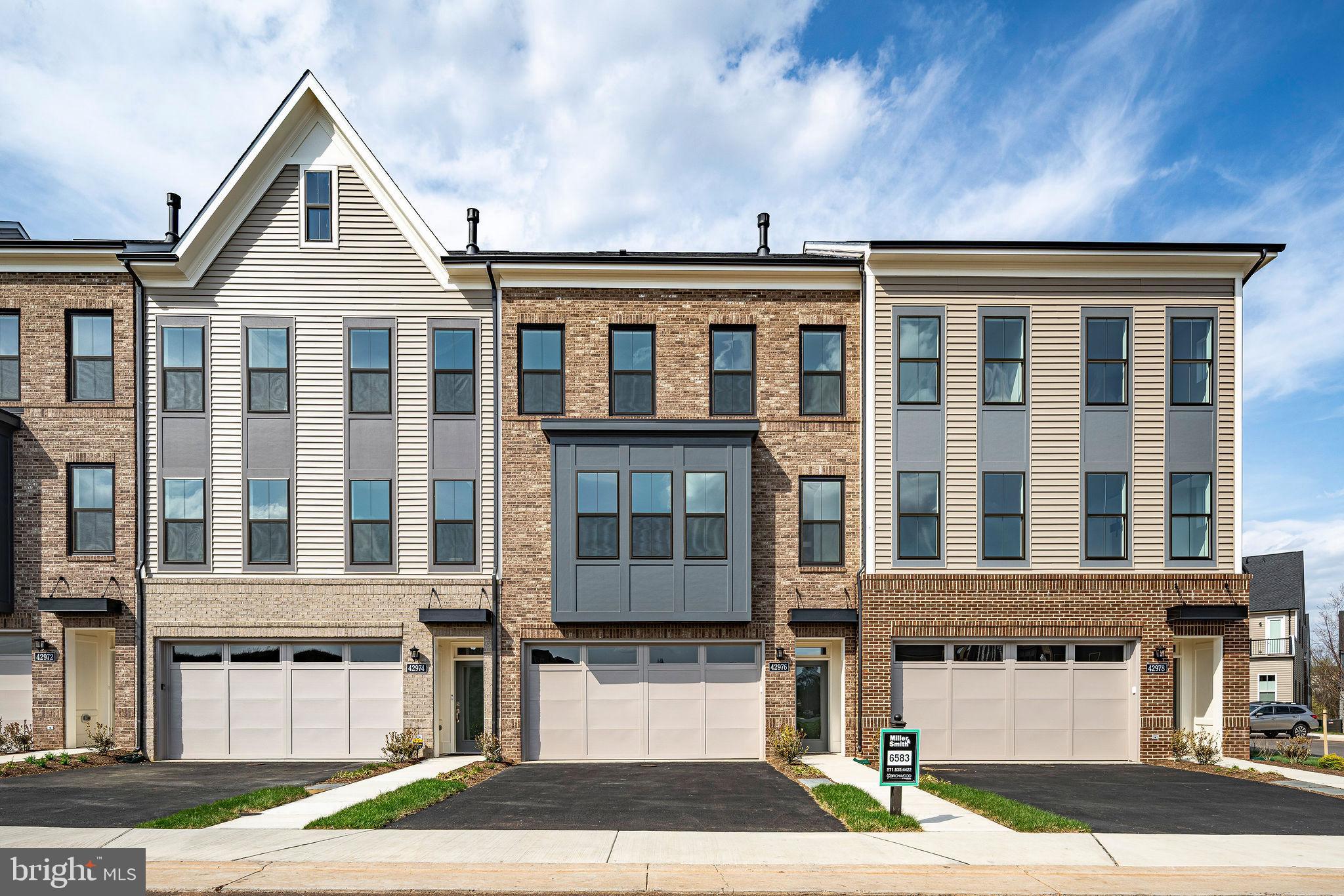 THIS IS IT - NEW MILLER & SMITH QUICK MOVE-IN ELEVATOR TOWNHOME in 55+ BIRCHWOOD COMMUNITY. Discover the Miraval floorplan with 2,742 sq. ft. will WOW! Featuring a private elevator, 3 bedrooms and 3.5 baths. This open-concept home includes a two-car garage, 9-foot ceilings, and high-end finishes throughout such as enhanced vinyl floors, 42" shaker kitchen cabinets, granite countertops, stainless steel appliances, gas fireplace, screened porch, and concrete patio.Enjoy the lifestyle you've been waiting for at Birchwood at Brambleton, with exclusive clubhouses including indoor and outdoor pools, exercise room, art studio, demonstration kitchen, and so much more! A home to love longer!                                                                                                                                                                                                                                                                                                                                                                                                                                                                                                                                                                                                                                                                                                                                                                 List base price subject to change.