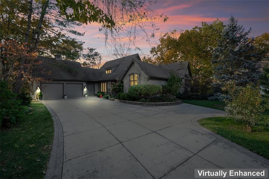 Welcome to 16750 S Village Drive, an elegant 4-bedroom, 2.5-bath residence situated within the coveted, gated community of Loch Lloyd. This refined home offers the privacy, security, and lifestyle that have made Loch Lloyd one of the premier addresses in the Kansas City region. The main level is designed for elevated living and effortless flow—featuring bright, connected spaces ideal for both everyday comfort and sophisticated entertaining. The kitchen and living area open to serene views of the surrounding trees and landscaping, creating a sense of calm and retreat. The primary suite is thoughtfully positioned on the main level for convenience and quiet, with a second bedroom nearby—perfect for a private office, nursery, or guest suite. Downstairs, two additional bedrooms offer separation and flexibility, accommodating guests, family, or personal workspace needs with ease. Outside, enjoy beautifully maintained grounds and the exclusive amenities that define the Loch Lloyd lifestyle: private championship golf, tennis, fitness center, clubhouse dining, lake activities, walking trails, and 24/7 gated security. A rare opportunity to enter this exceptional community—where luxury, comfort, and privacy are unmatched.