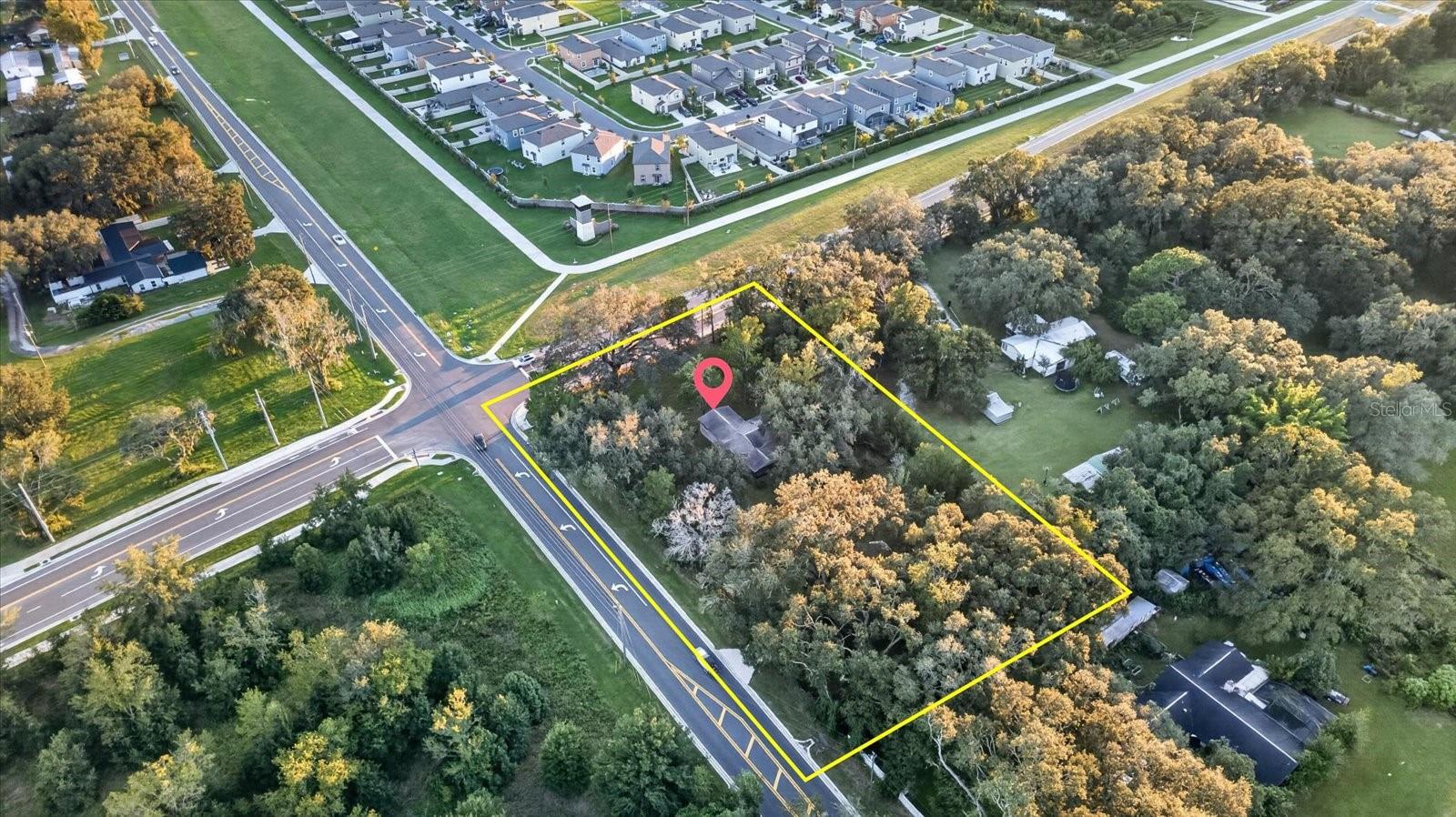 1.06-ACRE CORNER LOT | PRIME CURLEY ROAD LOCATION | No HOA, NO CDD and NO Restrictions, Roof 2017! Discover the possibilities with this 1.06-acre property located along the growing Curley Road corridor in San Antonio, just north of Wesley Chapel! Situated on a spacious corner lot with frontage along Curley Road and Tyndall Road, this property features a 3-bedroom, 2-bathroom single-family home offering approximately 1,304 sq. ft. of living space. Zoned AR (Agricultural-Residential), the property provides opportunities for residential living, outdoor activities, and potential future rezoning. The generous lot size offers room for storage, recreation, storage, or other permitted uses. Conveniently located near Wesley Chapel, SR 54, I-75, shopping, dining, schools, medical facilities, and expanding residential communities. Whether you're seeking a primary residence with acreage, an investment property to rezone to commercial uses, or a property with long-term potential, this location offers an appealing combination of land, accessibility, and flexibility. OVER AN ACRE OF LAND IN A GROWING PASCO COUNTY CORRIDOR ! Schedule your private showing today!