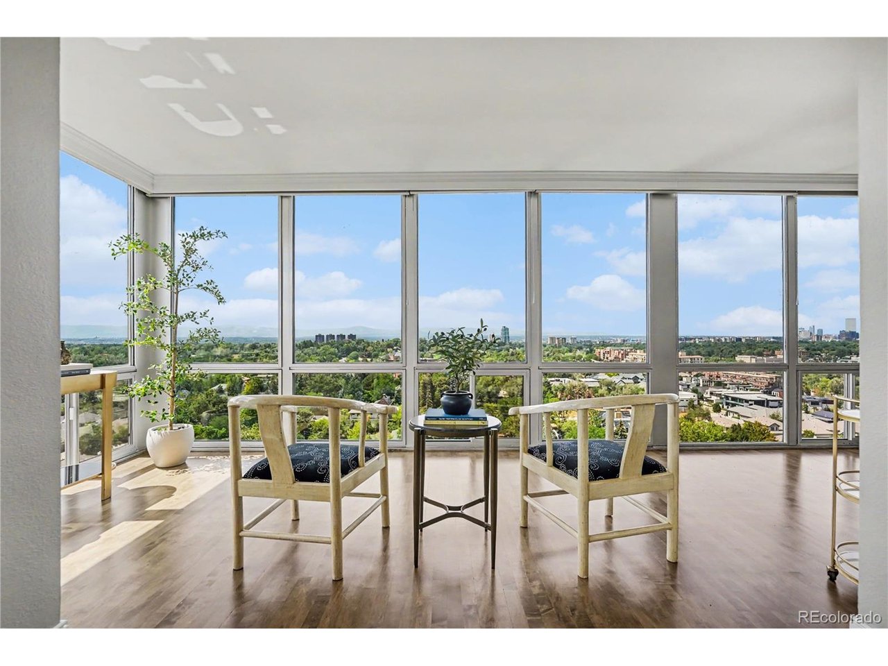 Perched high above the treetops of Cherry Creek, this stunning penthouse residence offers something truly rare: unobstructed south and west-facing views of the Front Range that shift and glow with every sunset. Unit 1504 is the full package, a rare combination of elevated design, thoughtful function, and one-of-a-kind scenery that you simply can't put a price on. Step inside to find solid wood floors that have just been freshly refinished, bringing warmth, richness, and a like-new polish throughout the home. The owner has also just completed a HVAC system update, offering a future buyer real peace of mind and efficient comfort year-round. Custom Hunter Douglas window treatments dress every window in the living space, adding a refined, tailored finish while also framing those incredible mountain views. The gourmet kitchen anchors the home, featuring top-tier appliances ready for everything from a quiet weeknight dinner to hosting friends against a stunning mountain backdrop. Two spacious bedrooms and two well-appointed bathrooms provide comfortable, private living, while the custom walk-in closet delivers a level of organization and everyday luxury rarely found in condo living. In-unit laundry rounds out the interior, ensuring penthouse living never sacrifices practicality. And yes...the views. Did we mention the views? From nearly every window and every angle, this residence frames the Front Range in a way that makes it impossible not to pause and take it all in, morning, noon, or night. Building amenities here are second to none, including a fully equipped fitness center, an inviting outdoor BBQ area, and a refreshing pool, resort-style living just steps from your front door. Unit 1504 also includes deeded parking and a dedicated storage unit, rounding out this rare offering with the practicality today's discerning buyers demand. This is elevated Cherry Creek living, literally and figuratively, Schedule your private showing today and experience it for yourself.