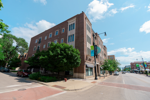Incredible opportunity to own this stunning 3BD/2BA condo in an elevator building on quiet, tree-lined Janssen Street! This spacious home showcases high-end finishes throughout and a gigantic private deck plus rare attached 2-car garage. The chef's kitchen is designed to impress with custom wood cabinetry, Viking range with hood, wine fridge, and premium stainless appliances. The expansive living area features Brazilian cherry floors, crown molding, and a cozy fireplace, perfect for entertaining or relaxing at home. Retreat to the luxurious primary suite with a massive walk-in closet and spa-like bath offering dual vanities, soaking tub, and oversized steam shower. Additional highlights include in-unit laundry, abundant storage, and well-appointed secondary bedrooms. New roof coming October 2025 (already paid for)! All this in the coveted Oscar Mayer School District, just steps to Wrightwood Park, restaurants, shops, and with easy access to the highway.