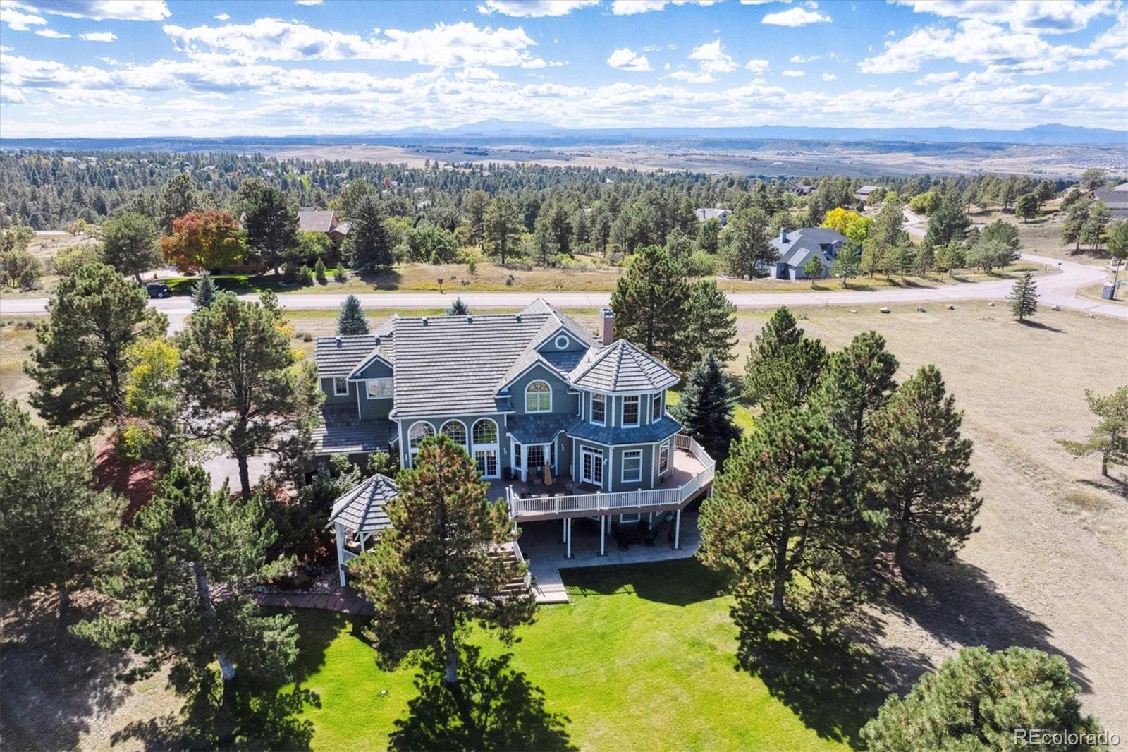 This stunning custom built home offers everything you've been searching for and more, perfectly situated on 2.3 private acres.  This home was designed with gorgeous architectural detail and an abundance of natural light.  As you walk in the front door your are greeted with beautiful hardwood floors. The main floor is designed for both relaxing and entertaining. The gourmet kitchen offers gas cook top, double-oven, large island, slab granite counter tops, wood beam ceiling, an abundance of counter space and a walk-in pantry. The living room features cathedral ceiling and a gas fireplace. Elegant dinning room with fireplace is perfect for formal entertaining.  On the second floor you will find a luxurious primary bedroom with office/retreat and recently renovated ensuite bathroom and two large walk-in closets. Three additional bedrooms and two bathrooms are also located on this level, with two connected by a Jack & Jill bathroom.  The walk-out lower level is designed for recreation and relaxation, featuring a spacious family room with fireplace, recreation room and bedroom with 3/4 ensuite bathroom.  Expansive outdoor living with large wrap-around deck and gazebo is ideal for relaxing or entertaining.