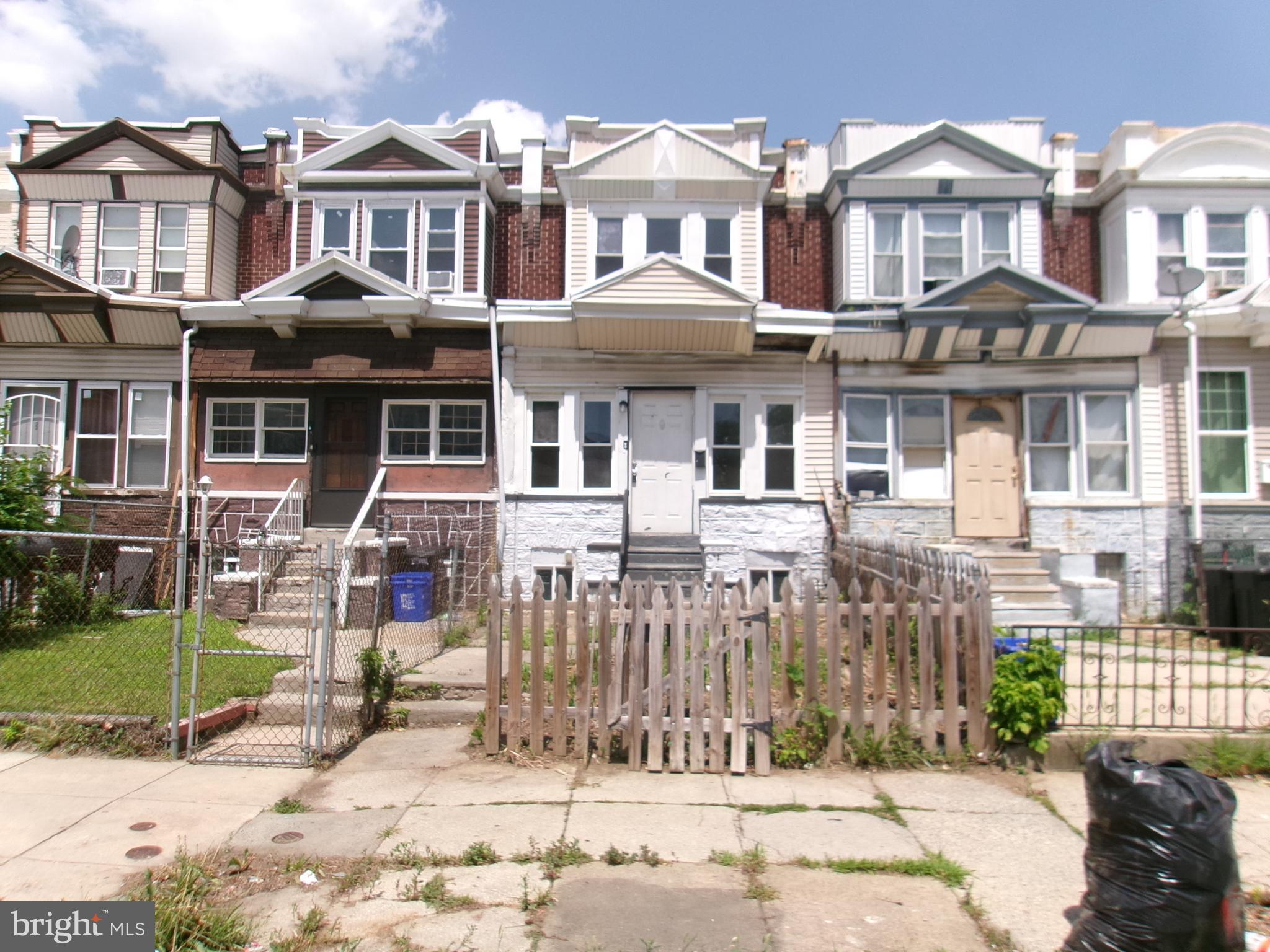 **BIG 3 BED/1 BATH WITH FRONT YARD IN COBBS CREEK READY FOR WORK**The property is in good condition for the price and location. A nice wide block with a great deal of potential to flip for sale or keep as a rental. Center entrance, large enclosed front porch with wide entrance to open living and dining area. The rear kitchen location is good, open and the layout already flows nicely.  Kitchen is walkout to the small patio area and it steps down to the rear alley with parking. The 2nd floor has 3 large bedrooms and an equally spacious bath with skylight. The basement is walkout and is clean and dry. Schedule your showing today or call for a private tour. AS-IS Addendum attached.