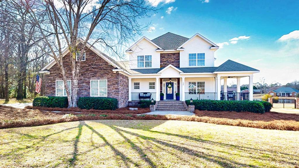 Located on the sought-after south side of Thomasville, this property has so much to love. The location is prime, just 30 minutes from Tallahassee and only 9 minutes from shopping and dining on the bricks in Downtown Thomasville. This home sits on 1.2 acres, quietly nestled lakeside in the Shallowbrook subdivision. The views go on for days and can be enjoyed while rocking on the front porch, grilling on the expansive back porch, or taking in romantic sunsets from the master suite's private upper deck. Make your way inside and you will fall even more in love. Rich hardwood floors, beautiful fixtures, and light, airy paint colors create a warm and inviting atmosphere. You may come for the aesthetics, but you will stay for the storage. There is generous closet space throughout, plus an upstairs bonus room that could serve as a workout space, playroom, or media room. Upstairs, the master suite is truly impressive, and all the bedrooms are graced with brand new hardwoods. A downstairs office and a third full bathroom provide flexibility and convenience, offering a place for everything and room for everyone. Call your favorite real estate agent today for a private tour.