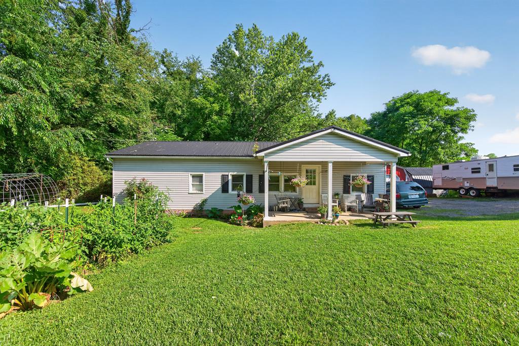 Check out this recently updated 3-bedroom, 1-bath home in Max Meadows! Thoughtfully improved and move-in ready, this property offers the perfect blend of modern updates, functional outdoor space, and versatile storage.  Inside, you'll find a completely renovated kitchen featuring updated cabinetry and finishes, along with new flooring throughout much of the home. A new heat pump provides year-round comfort and energy efficiency, making this home as practical as it is inviting.  Step outside to enjoy the spacious backyard, perfect for entertaining, gardening, pets, or simply relaxing. The property also includes several well-maintained outbuildings that offer endless possibilities for storage, hobbies, or workshop space. Highlights include a 12' x 12' wired green and tan mini barn, a newly finished, insulated, and wired 12' x 24' red garage-style building complete with a loft, plus two gray/blue mini barns with new metal roofing. One of the gray/blue buildings also features a newly added lean-to for additional covered storage.  Pet owners will appreciate the underground dog fence, installed in 2026, allowing your four-legged family members room to roam safely.  Whether you're looking for your first home, a place to downsize, or simply want a property with exceptional outdoor storage and workspace, this one checks all the boxes. Schedule your private showing today and discover everything this wonderful Max Meadows property has to offer!