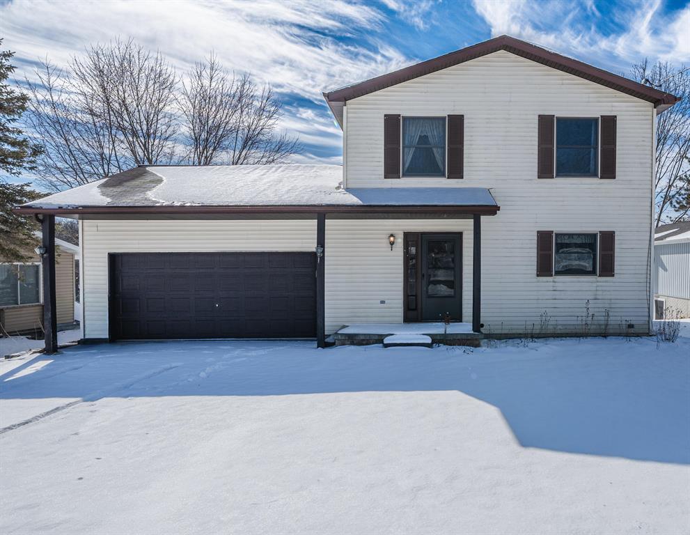 Step through the front door of this charming two-story, 3 bedroom, 2.5 bath home and into a warm, welcoming entryway that immediately sets the tone for comfortable and inviting living. To the right, you'll find a cozy eat-in kitchen featuring a convenient breakfast bar, perfect for casual meals, morning coffee, or gathering with friends and family. With ample cabinet and counter space, it offers both functionality and charm. The kitchen flows seamlessly into the living room, filled with natural light from large windows that showcase beautiful views of the backyard and lake beyond, while a wood-burning fireplace creates a cozy focal point, ideal for relaxing evenings or entertaining guests. The open layout makes this space perfect for both everyday living and special occasions. Upstairs, the home offers three well-appointed bedrooms, including a generous primary suite designed for comfort and privacy, complete with its own ensuite bath.The additional two bedrooms are nicely sized and share a full bath conveniently located just outside their doors, making the upper level both practical and well-designed. The unfinished basement provides abundant storage space and endless potential, whether you envision a future finished area or simply need room to stay organized. A dedicated laundry room with a utility sink adds extra convenience and functionality to the home. From the living room, step through sliding glass doors onto a large deck overlooking the backyard and the peaceful waters of Lily Lake. This serene outdoor setting is perfect for morning coffee, evening sunsets, or hosting summer gatherings. The yard features a shed and a private dock--both wired for electricity--making lakefront living as enjoyable as it is convenient. Completing the home is an attached two-car garage, offering additional storage and everyday ease. With its thoughtful layout, inviting spaces, and beautiful lake views, this home truly offers the perfect blend of comfort, functionality, and charm.