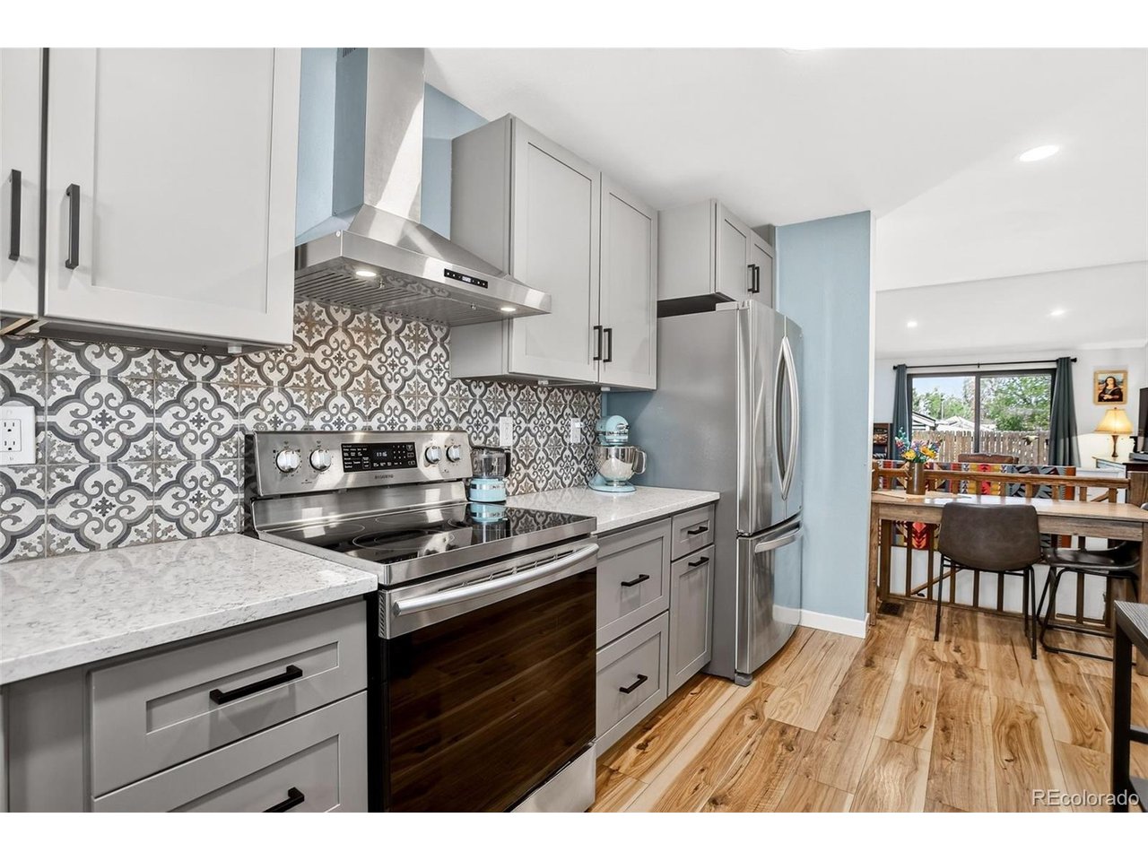 From the moment you arrive, there's an immediate sense of ease. Everything has already been done-thoughtful, beautiful, and with intention. Step inside and you're greeted by an open layout where every detail feels fresh and cohesive. New windows, sliding door, wide-plank flooring, and a seamless flow between living, dining, and kitchen which is is both stunning and functional & creates the kind of environment that simply lives well. Whether it's a quiet morning coffee or enjoying with company. Every inch of this home has been elevated. Remodeled bathrooms, updated fixtures, fresh paint, and finished basement offer flexibility for guests, a home office, workout space, or media room. Private fenced yard, perfect for summer evenings, pets, or gathering under the Colorado sky. Newer HVAC and hot water heater provide peace of mind-so you can focus on enjoying the home, not maintaining it.What truly sets this property apart is the lifestyle that surrounds it. Maplewood is more than a neighborhood-it's a community. Impromptu gatherings, seasonal events & neighbors who actually know each other. The wider area carries a rare charm: Free Libraries on quiet streets, dog bowls set out on sidewalks all add to the character. Just minutes away, Tennyson Street comes alive with festivals, art walks, and some of Denver's best locally owned restaurants, shops, and coffee spots. Along 38th Avenue, parades and community events bring energy and connection throughout the year. Here, walkability meets authenticity. Historic brick homes, classic bungalows, and modern builds blend together in a neighborhood that feels curated over time. It's the kind of place where you can walk to dinner, know your neighbors, and still be perfectly positioned-close enough to downtown for convenience, yet with effortless access to the mountains when you want to get away.This is more than a beautifully remodeled home. It's a lifestyle-one that's increasingly hard to find. And it's waiting for you.