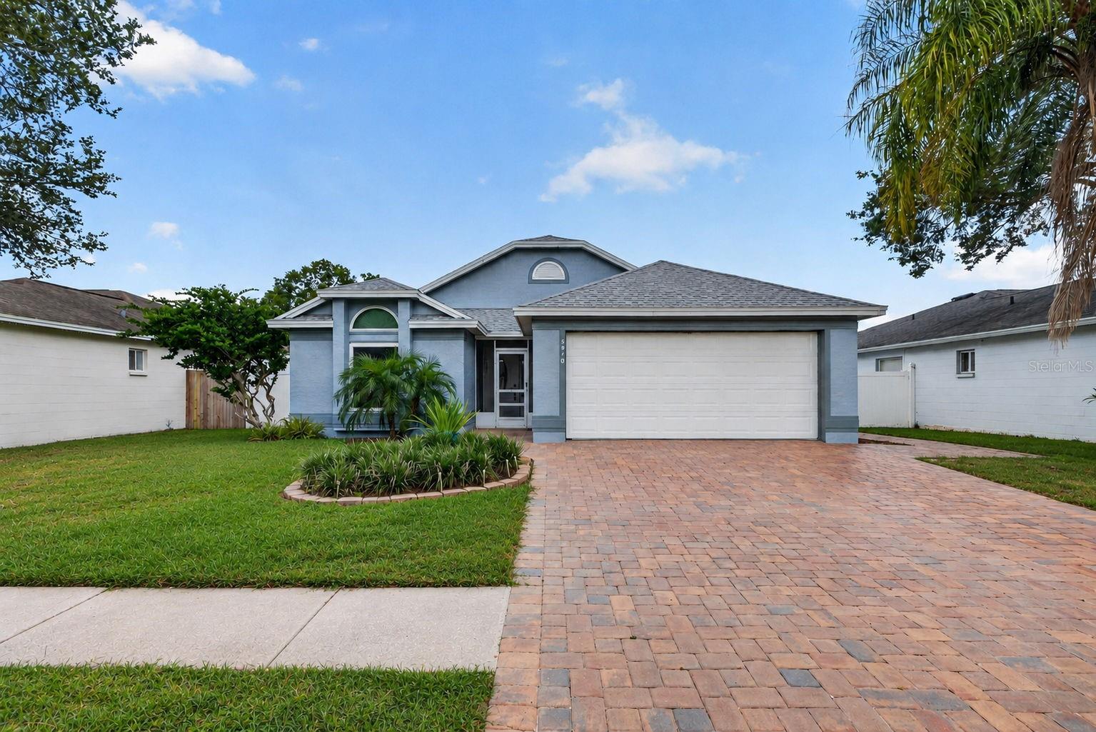 Welcome to this exceptionally well-maintained 3-bedroom, 2-bath block home, tucked away on a quiet cul-de-sac in the desirable Meadow Glen community. This Tampa home features a split-bedroom floor plan, vaulted ceilings, abundant natural light, and generous storage throughout.The kitchen features GE stainless steel appliances, ample cabinetry, a pantry, and a comfortable eat-in dining area, while vaulted ceilings give the main living spaces an open and airy feel.Privately positioned at the back of the home, the primary suite offers a vaulted ceiling, walk-in closet, and updated en-suite bathroom. Two additional bedrooms are located toward the front of the home and share a full hallway bathroom, creating comfortable separation between the primary and secondary bedrooms.Outside, enjoy a fully fenced backyard with a screened lanai, extended paver patio, garden area, and vinyl privacy fencing. A new paver driveway adds to the home's curb appeal and extends along the side of the house for convenient additional access and storage.Many of the home's major improvements have already been completed, including a new Roof in 2025, HVAC system in 2023, Hurricane Impact Windows and Doors, Hurricane-rated Garage Door, new LG dishwasher, and Samsung Washer and Dryer.Located in Flood Zone X, this home offers convenient access to shopping, dining, parks, major roadways, Tampa International Airport, and Downtown Tampa.