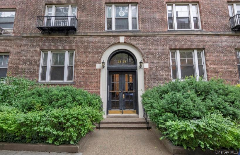 Welcome to Landmark Hampton Court, a distinguished prewar condominium/cooperative residence in the heart of the Jackson Heights Historic District. Built in 1920 and designed by architect George H. Wells. Offering an intimate living experience, the building features just three units per floor with a total of 15 residences. This bright and inviting two-bedroom, one-bath home offers classic architectural character with a highly functional layout. Situated on the fourth floor, the apartment features oversized east- and west-facing windows that provide excellent natural light throughout the day. Interior details include approximately nine-foot ceilings, plaster walls, oak strip flooring, and elegant moldings, all contributing to the warmth and charm of a traditional prewar home. The residence includes a welcoming foyer, double sized living room with potential opportunity to utilize into guest bedroom and/or study room, two well-proportioned bedrooms, and updated kitchen and bathroom spaces.Hampton Court is widely admired for its beautifully maintained interior garden, considered one of the most appealing courtyard spaces in the Historic District. The building is well cared for and offers practical conveniences, including basement laundry facilities, a complimentary storage bin, and the services of a live-in superintendent.The location offers an exceptional combination of neighborhood character, daily convenience, and transportation access. Travers Park is approximately 0.3 miles away and provides tennis courts, basketball courts, playgrounds, and open recreational space. The residence is also close to the 34th Avenue Open Street, known as Paseo Park, a multi-block pedestrian and cycling corridor that enhances the area’s residential appeal. The 37th Avenue retail corridor is approximately 0.15 miles away and features a variety of coffee shops, restaurants, and neighborhood grocers, including Ferreira Foodtown, Food Dynasty, and Premium Market. Subway service at 74th St–Broadway and Jackson Hts–Roosevelt Ave—serving the E, F, M, R, and 7 trains, along with the LaGuardia shuttle—is approximately 0.4 miles away, providing convenient access to Manhattan and the surrounding boroughs.Interior Features• Expansive living room suitable for everyday living and entertaining• Oversized east- and west-facing windows with generous natural light• Approximately nine-foot ceilings that enhance the sense of space• Excellent cross-ventilation with windows on both sides of the residence• Oak strip hardwood flooring that complements the prewar design• Newly installed dishwasher and stove for added kitchen convenienceOutdoor and Building Conveniences• Beautiful shared courtyard garden offering a peaceful outdoor setting• Low monthly maintenance fee• Basement laundry facilities and additional storage space for added convenience