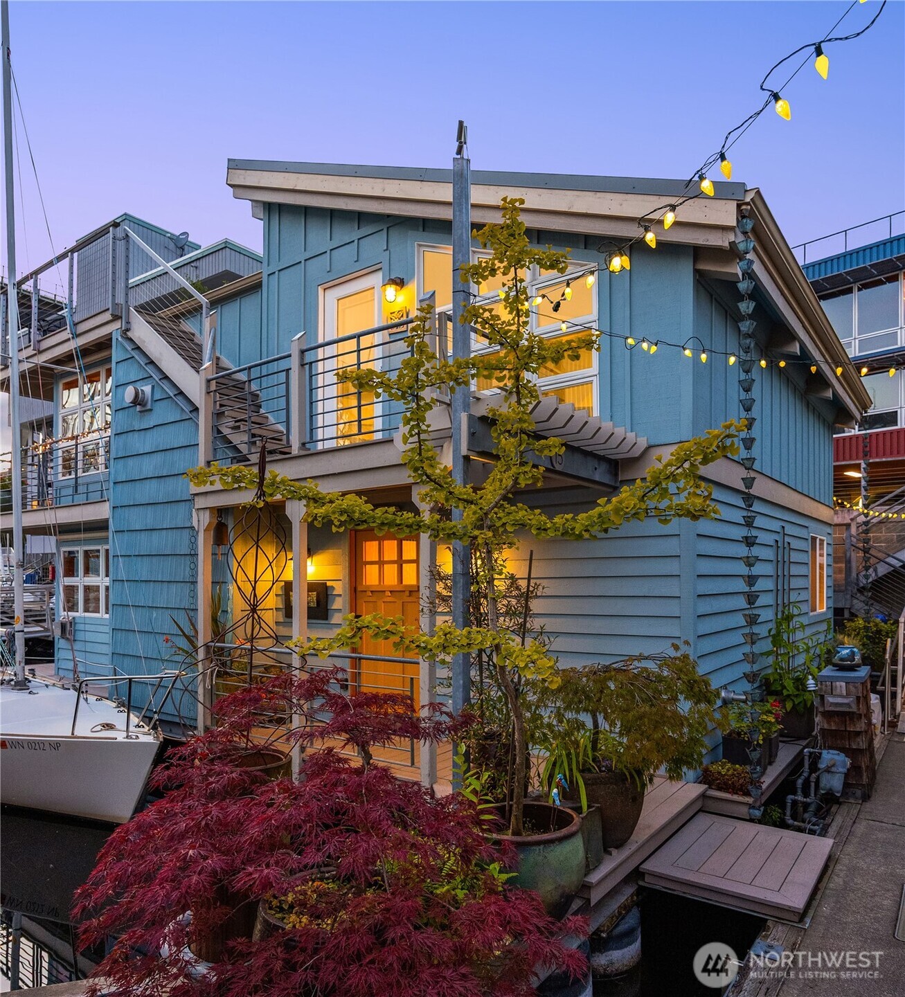 Contemporary floating home in the heart of Fremont with moorage & reserved parking in one of Seattle's most coveted docks! Unique position jutting into the channel offers unobstructed water views and a rooftop deck with breathtaking views of the lake, downtown & Mt Rainier. Reverse floorplan with W-facing light, spacious main floor bedrooms, open-concept living area upstairs & view decks on both levels. Durable, low-maint. concrete float with great storage. 1 extra-wide deeded garage spot & 1 'part-time' spot for evenings/weekends. 21'+ boat slip next to home & many nearby slips for rent. Low HOA dues & strong reserves at 'Lee's Moorings', Fremont's only floating home dock. Just a short stroll from restaurants, PCC, shops & Gasworks Park.