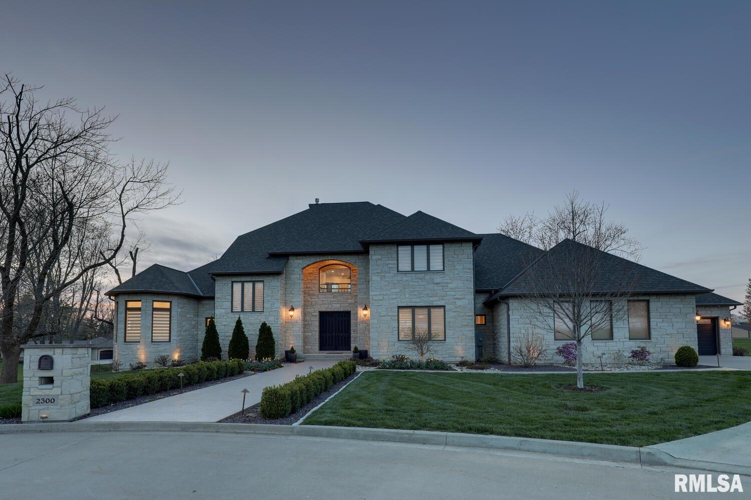 Discover unparalleled elegance at 2300 Greenspointe Circle, Quincy, IL. This 4,446 sq ft masterpiece, crafted by renowned Holtmeyer Construction, boasts 5 spacious bedrooms, 4 full baths, and 2 half baths. Nestled on the golf course, this home is surrounded by million-dollar estates in an exclusive community. Featuring a grand 4-car garage, this residence offers ample space and sophistication. The open-concept design showcases high-end finishes, expansive windows, and stunning views of the lush fairways. Perfect for entertaining, the gourmet kitchen flows seamlessly into the living areas, while the luxurious master suite provides a serene retreat. This custom-built gem redefines luxury living. Schedule a private tour today to experience its unmatched charm and elegance!