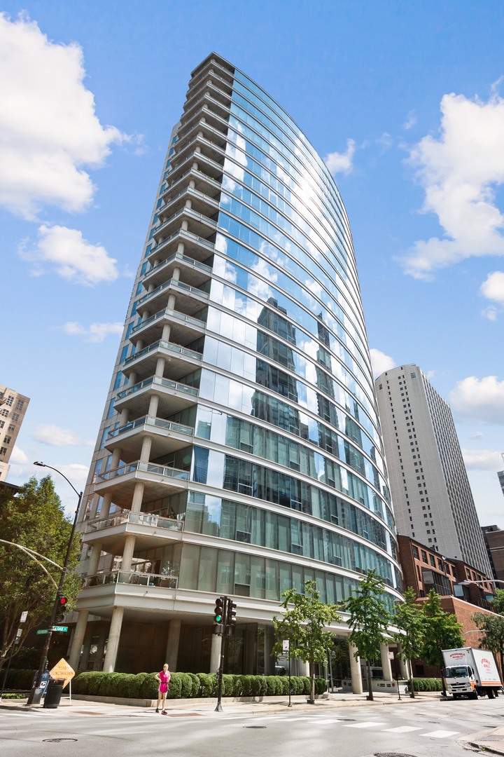 Rare opportunity to own in one of the Gold Coast's most sought-after buildings. This oversized 2-bedroom, 1.1-bath condo offers 11-foot ceilings, honed Bianco white marble floors, custom lighting, and floor-to-ceiling windows with two exposures for abundant natural light. The expansive open living and dining area centers around a stunning Poggenpohl Chicago kitchen, featuring a large quartz-topped island, generous cabinetry, and premium Miele, Thermador, and Sub-Zero appliances-perfect for both everyday living and entertaining. The primary suite showcases espresso-stained hardwood floors, an oversized, fully customized walk-in closet, and a luxurious Calacatta marble bath with striking veining. The second bedroom, finished with Bianco white marble floors, works equally well as a guest room, den, or office. Additional highlights include a full-size washer and dryer, same-floor storage, and one heated garage space. This prestigious, pet-friendly building offers a modern lobby, 24-hour door staff, a fitness center, and a prime location near Chicago's finest dining, shopping, and schools.
