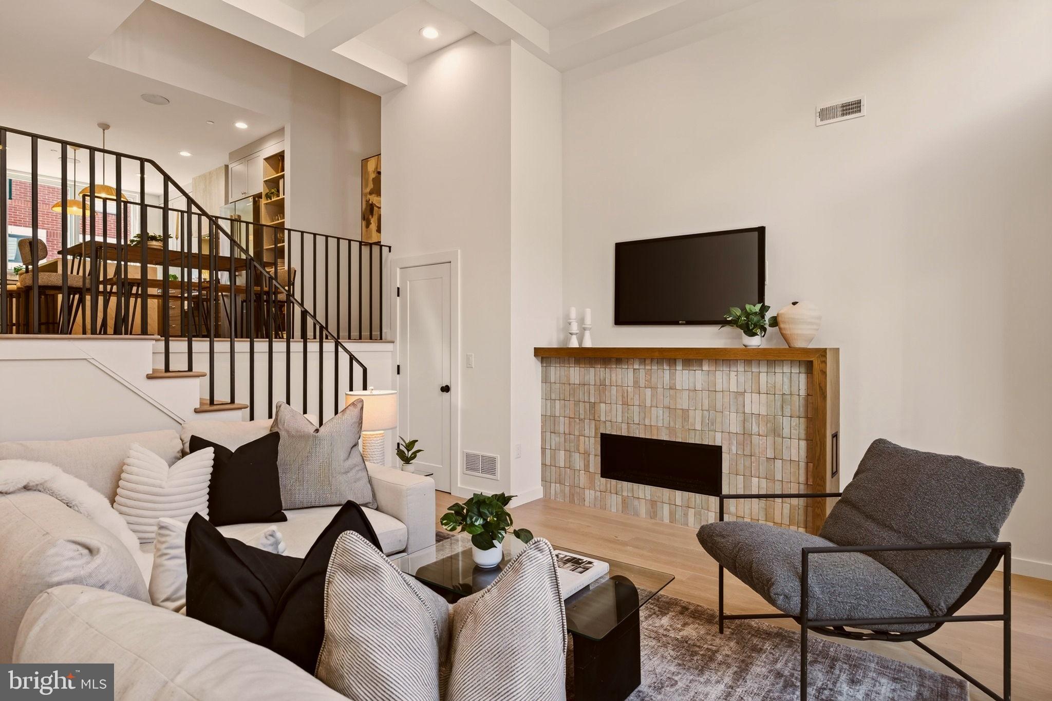 Only two fully upgraded interior units remain at Wendle Place Phase 4, and this is one of them. Welcome to 960 N 6th Street, a brand-new townhome in one of Philadelphia's most sought-after new construction communities, finished in the top upgraded interior package. Phase 4 offers four finish packages across the community, and photos shown include one of the four available packages. Spanning approximately 3,000 square feet over four levels plus a fully finished lower level, this home follows the same premium layout as Phases 1 and 2. The main living area is a dramatic split-level space with soaring ceiling heights, oversized windows, wide-plank wood floors, and a gas fireplace as the focal point. The open kitchen is built for both everyday living and entertaining, with a large island, eat-in dining area, upgraded countertops, stainless steel appliances including a six-burner range, built-in microwave, and a wet bar. A powder room on the main level keeps guests comfortable. Upstairs, the first bedroom level offers two bedrooms and two full baths, giving guests or family their own private space. The next level is dedicated to a single bedroom suite with a walk-in closet, primary bath with stall shower, and an additional half bath. Laundry is located on an upper floor for convenience, and the washer and dryer are included. Outdoor space is a standout, with multiple balconies and a private rooftop deck with a green roof. A rear-entry 2-car attached garage with inside access means covered, off-street parking in one of the city's most walkable neighborhoods. Every home includes the full 10-Year Tax Abatement and a 1-Year Builder's Warranty. Developed by Catalyst City Development and designed by Gnome Architects, Wendle Place pairs modern design with a curated palette of premium materials and careful craftsmanship throughout. Set on tree-lined 6th Street in the heart of Northern Liberties, Wendle Place is steps from Bardot Café, Café La Maude, and Liberties Walk, with easy access to dining, shopping, bike trails, and public transit. With only two upgraded units left, this one will not last. Schedule your private showing and ask about financing options with our preferred lender.*