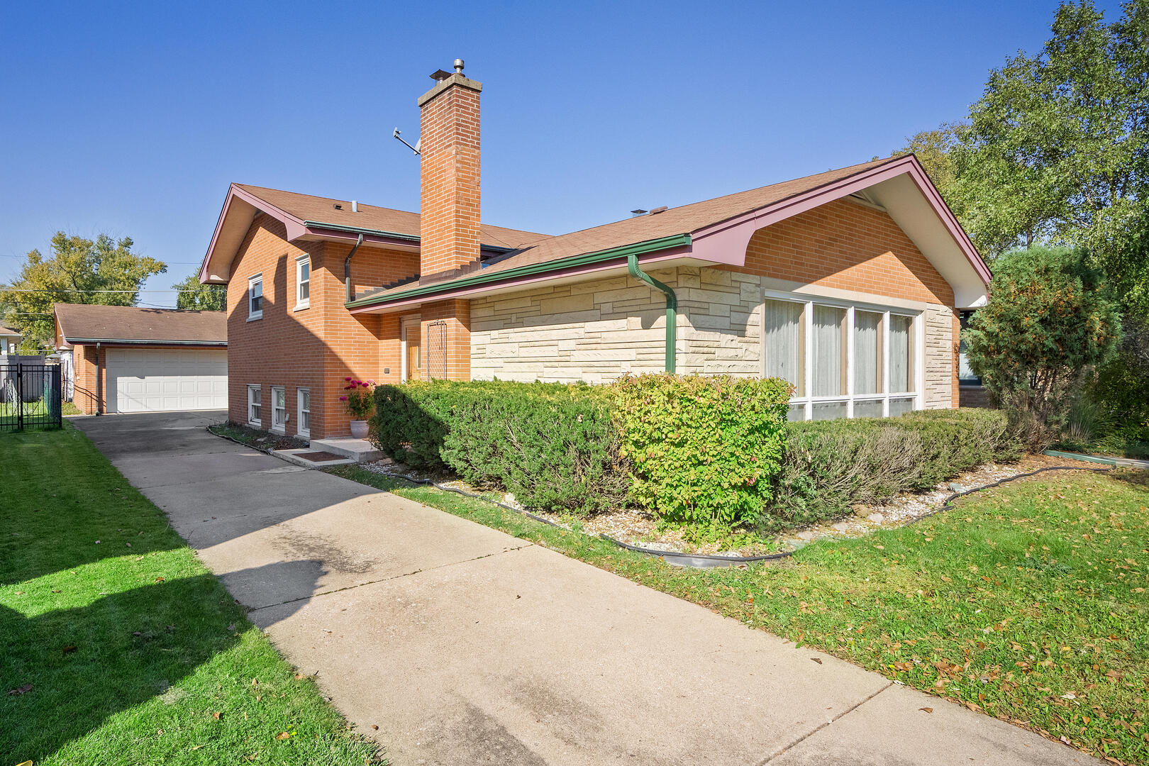 Solid brick bi-level home offering exceptional space, classic charm and endless potential. Step inside to discover a spacious, well-designed floor plan featuring a welcoming foyer that opens to an expansive living room with front yard views and a natural flow into the adjoining dining room-ideal for entertaining family and friends. The generously sized kitchen offers ample cabinetry and convenient table space for everyday dining. The upper level features three spacious bedrooms, generous closet space and a full bathroom. The lower level provides additional living space with a comfortable family room, gas log fireplace and built-in dry bar, full bathroom, a fourth bedroom or home office and a dedicated laundry room. The sub-basement adds even more versatility, featuring a recreation room, sauna, utility area and abundant storage space. A detached two-car garage completes the property.  Ideally located within the highly regarded Brook Park Elementary, S.E. Gross Middle School and Lyons Township High School Districts, this home offers convenient access to shopping, dining and the charming downtown areas of La Grange and Brookfield. Enjoy nearby parks, forest preserves, and major expressways for an easy commute, plus easy access to the commuter train to the city. With its solid brick construction, generous living space and outstanding potential, this property is a wonderful opportunity to create your dream home. The property is being conveyed in as-is condition.