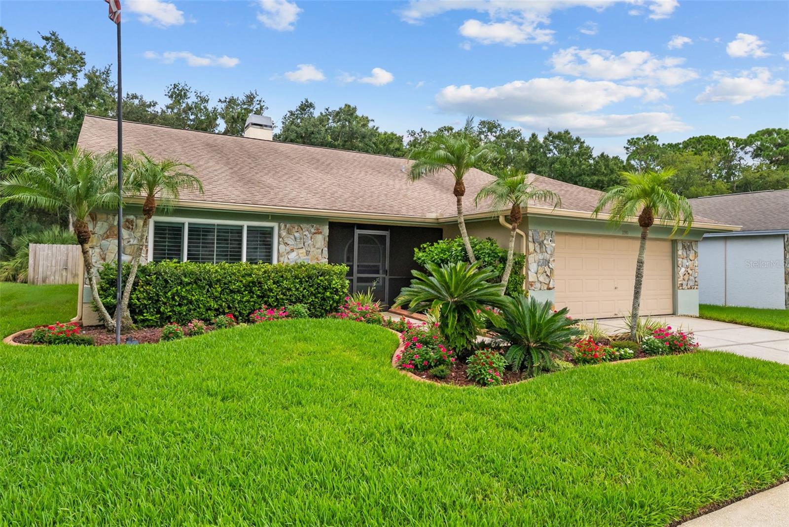 WELCOME TO THE PERFECT FLORIDA LIFESTYLE! Beautifully updated ONE-STORY 2,040 SF 4 BR/2 BA/2-CAR GARAGE POOL HOME on PRIVATE CONSERVATION LOT w/LARGE FULLY-FENCED LOT in the highly sought-after WESTCHASE/COUNTRYWAY AREA.  ZONED TO TOP RATED SCHOOLS, too!  Tucked away near the back of the neighborhood (low traffic), this home offers a DAILY opportunity to get in touch with nature with its peaceful conservation views and frequent visits from DEER, RABBITS, COLORFUL BIRDS, OWLS and other Florida wildlife. Conservation lots in Countryway are COVETED: MORNINGS, while sipping your coffee, listen to the birds chirping, watch squirrels chase each other around and EVENINGS, wind down while spotting a deer or two at sunset (especially with a salt lick!) and later, listen to the faint sound of crickets and owls hooting to prepare you for bed.  Inside, notice the bright OPEN FLOOR PLAN, soaring VAULTED CEILINGS, WOOD-LOOK TILE FLOORING THROUGHOUT, elegant PLANTATION SHUTTERS, and a cozy WOOD-BURNING FIREPLACE (make S'mores in winter!). Large sliding glass doors provide view of BEAUTIFUL CONSERVATION, POOL and LARGE COVERED LANAI while filling the home with ABUNDANT NATURAL LIGHT.  The UPGRADED KITCHEN is designed for both everyday living and entertaining. Step outside to your own private oasis featuring a SCREENED POOL, NEW PAVER POOL DECK, REFINISHED POOL SURFACE, and a SPACIOUS COVERED LANAI—perfect for relaxing in the shade, entertaining family and friends, or cooling off after a day in the Florida sun. Mount a TV in the covered lanai and float in the pool while listening to music or watching your favorite sports team.  The perfect Florida lifestyle!  The LARGE FULLY FENCED BACKYARD overlooks conservation and includes a storage shed.  *** MONEY SAVINGS FOR NEW OWNER *** >> OVER $100K IN UPGRADES including a NEWER HVAC SYSTEM (2021–~$11K), HURRICANE IMPACT WINDOWS (2022–~$15.3K), ROOF (2016–~$12K), MAJOR REMODEL PROJECT (2020-$~37.5K): KITCHEN REMODEL incl. RAISED-PANEL WOOD CABINETRY w/ CROWN MOLDING, GRANITE COUNTERTOPS, STAINLESS STEEL APPLIANCES, CUSTOM pantry & BREAKFAST BAR add-ons, updated fixtures, new sink; NEW cabinetry in laundry room; NEW WOOD LOOK TILE in liv. room/family room/hallway; HALL BATH REMODEL including NEW JETTED  TUB, shower tile, shelving, toilet, vanity, fixtures, STONE COUNTERTOP and UPDATED lighting; NEW PLANTATION SHUTTERS-all rooms (2019-~$9K); NEWLY PAINTED/RECSCREENED pool cage (2026-~$5K); NEW POOL PVERS-pool area ($~5K); NEW LANDSCAPING CURBING-front/back yards (2020-$3.5K); NEW LANSCAPING-front yard (~$1K); RECENTLY CLEANED DUCTWORK plus NEW UV Light w/warranty (2023-~$1K); NEW OUTDOOR SHED (~$2.5K).  Countryway is one of Tampa Bay's most sought-after communities, offering LOW HOA FEES, NO CDD, & outstanding amenities incl. tennis courts, basketball courts, volleyball courts, baseball field, playground, parks, a dog park & miles of scenic walking & biking trails.  PERFECT LOCATION IN TAMPA BAY - NESTLED IN CONSERVATION, but CENTRALLY LOCATED IN TAMPA BAY - 20–25 MINUTES TO TAMPA INT'L AIRPORT, DOWNTOWN TAMPA, AND FLORIDA'S AWARD-WINNING GULF BEACHES, 15-20 mins. from cultural towns of Dunedin, Tarpon Springs, Palm Harbor and Safety Harbor, and just 8 MINUTES to WEST PARK VILLAGE with its SHOPPING, DINING, ENTERTAINMENT.  This home offers the perfect balance of convenience and tranquility.  Enjoy the GOOD LIFE and make wonderful memories in this nature-filled peaceful, MOVE-IN READY, BEAUTIFULLY UPDATED oasis!