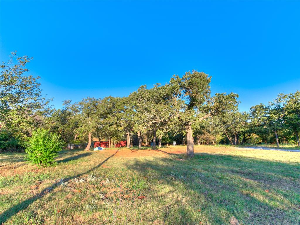 Are you looking for the perfect spot to build your dream home? If so- this property may be the perfect one for you! This beautiful 5 acres sits just off the paved road of 108th NE. Location is prime as it is just far out enough to be out of the hustle and bustle of the city, but yet only minutes to Lake Thunderbird and everything Norman has to offer. This property is already equipped with an operating well, electric, a shop/storage building, a storm shelter, and tons of deer! All you need to do is bring your builder!