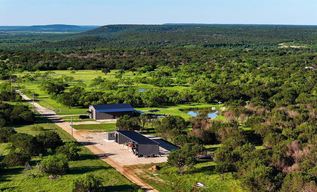 237 acres in Palo Pinto County just north of Graford, Texas, and Possum Kingdom Lake.  Located just off Highway 337 along Sikes Road, you will find the main gated entrance to the property.  The current owner has improved and manicured the property to be a turn-key recreational ranch.  
 The ranch is perimeter fenced with some new fencing, 3800 feet of 5-strand barb wire, on the north side along with a road completely around the inside of the fence.  Several nice ponds are scattered across the ranch along with 4 elevated blinds, each with a 600-pound wildlife feeder.  Numerous areas have been cleared and the tree canopies raised. Winter wheat and sunflowers have been planted in a small field in the back portion of the property.