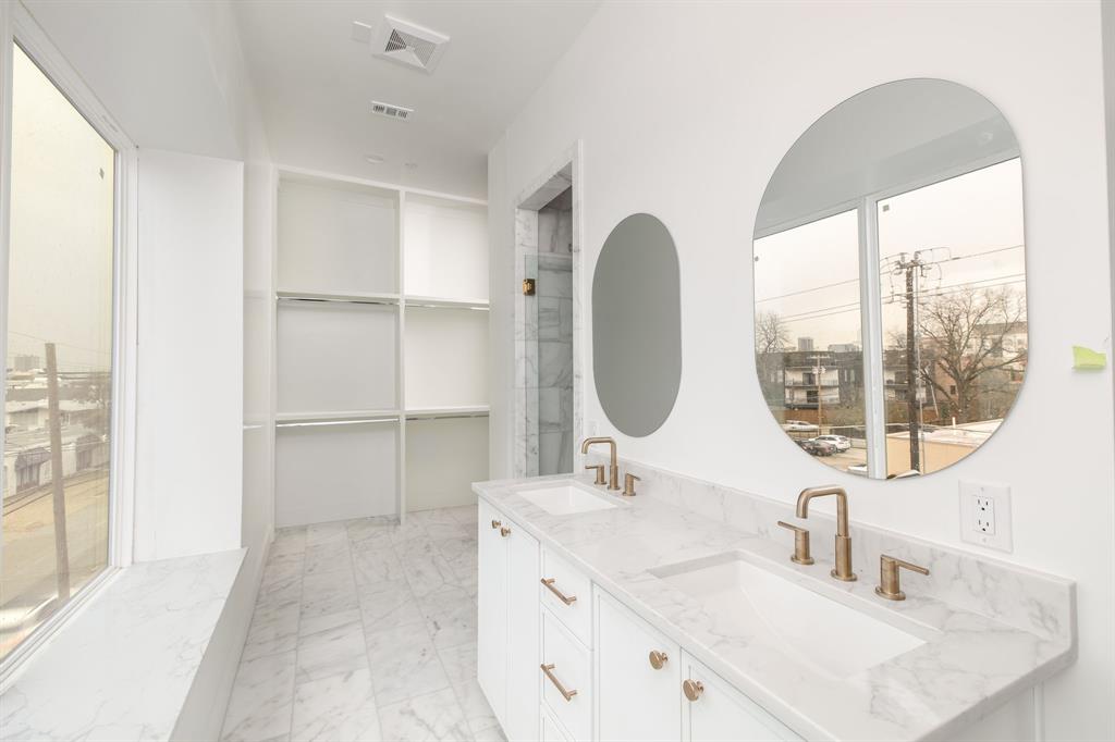 Introducing The Heights at Oak Lawn, a brand new 2026 three story residence by the renowned Strange and Sons Development. This modern townhome features three bedrooms and three and a half baths with wide plank hardwoods and an airy open concept living level. The chef’s kitchen showcases an oversized waterfall quartz island, custom white cabinetry with warm wood accents, brass hardware and fixtures, a mosaic tile backsplash, and statement dome pendants. Large sliding doors open to a street facing balcony for morning coffee and evening people watching. The serene primary suite offers a spa worthy bath with dual vanities, marble look counters, brass fixtures, and a glass enclosed shower, complemented by boutique style closet storage. Two secondary bedrooms each enjoy their own full bath, and a stylish powder bath serves guests on the main level.A third floor flex lounge flows to a private rooftop terrace with neighborhood and skyline views, ideal for entertaining. Clean modern lines, energy efficient windows, and recessed lighting enhance the home throughout. Step outside to everything Oak Lawn is known for, including vibrant dining, nightlife, cafes, and fitness spots along Cedar Springs, with instant access to Wycliff Avenue and the Dallas North Tollway, plus quick proximity to Uptown, the Design District, and Love Field. Contemporary design, multiple outdoor spaces, and an unbeatable location welcome you to life at The Heights at Oak Lawn.